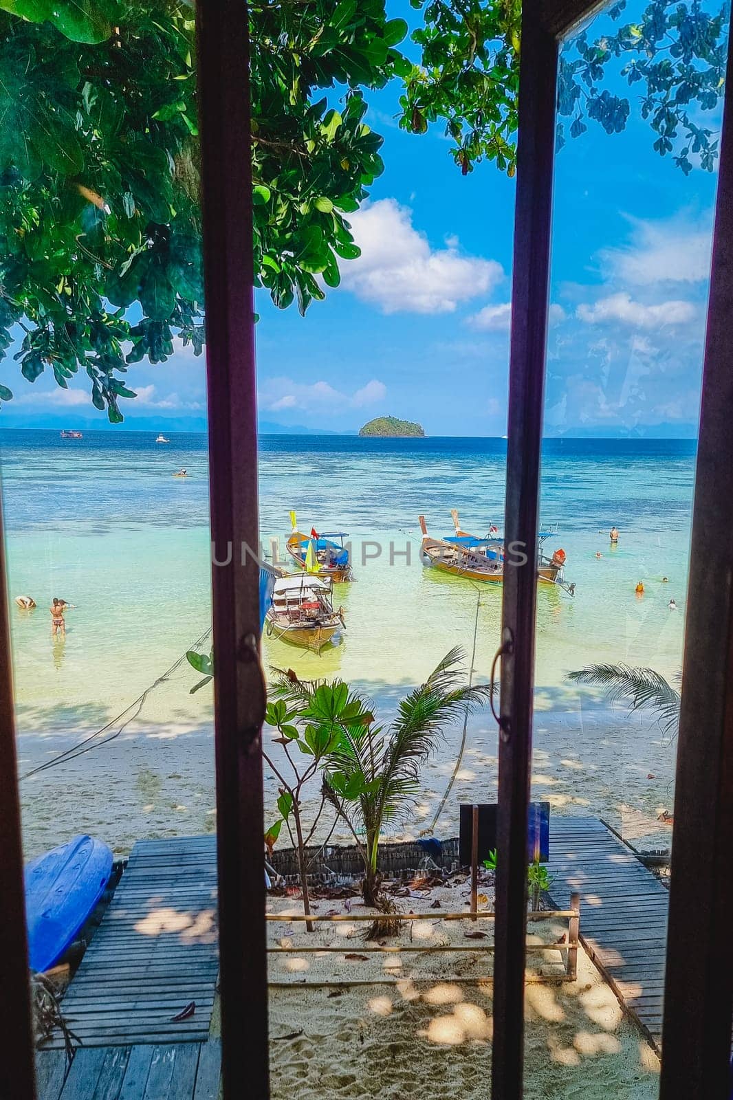 Koh Lipe Island Southern Thailand view from the window with turqouse colored ocean and white sandy beach at Ko Lipe.