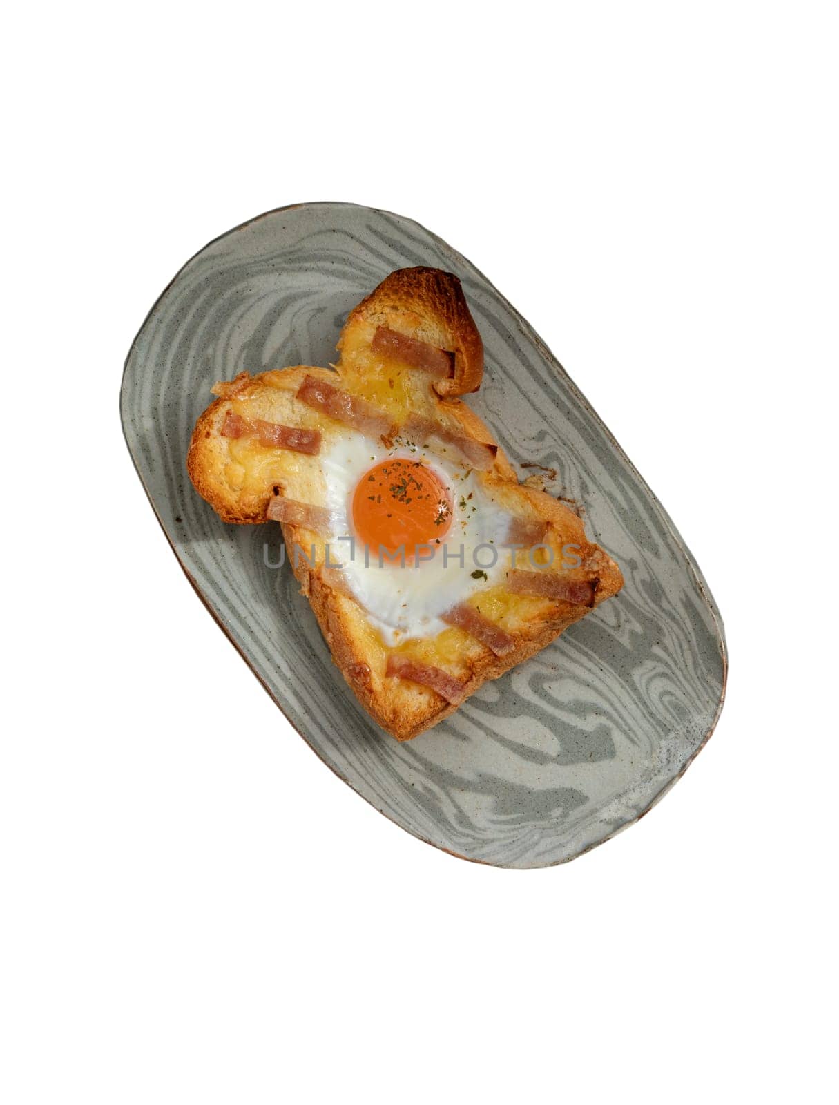 Homemade fried egg in a hole Bacon and Cheese toast on ceramic tray isolated on white background with clipping path. Sandwiches for breakfast, The concept of delicious food, Selective Focus.