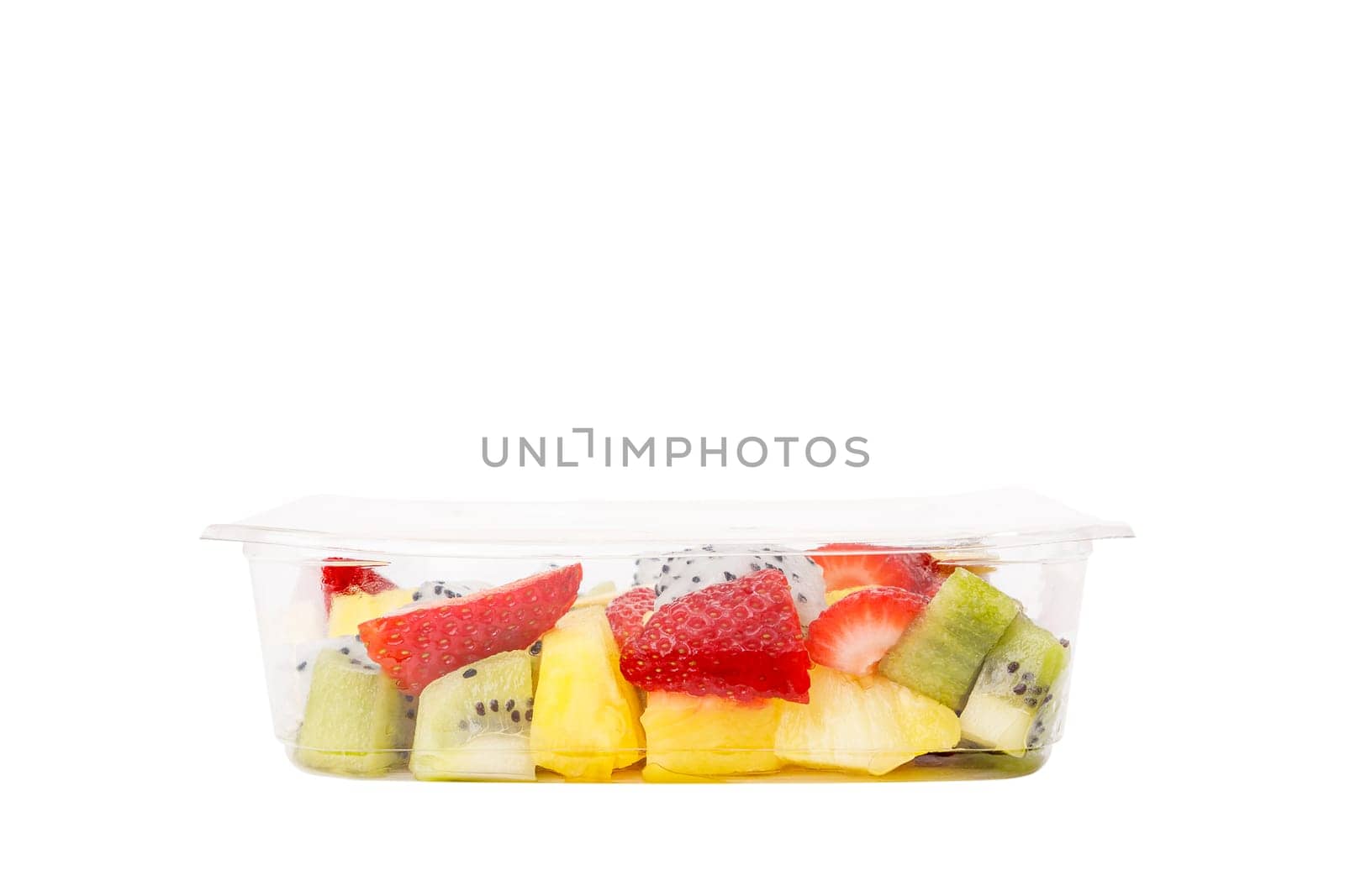 Fruit salad of pineapple, strawberry, kiwi and pitahaya in a plastic container on a white background. High quality photo