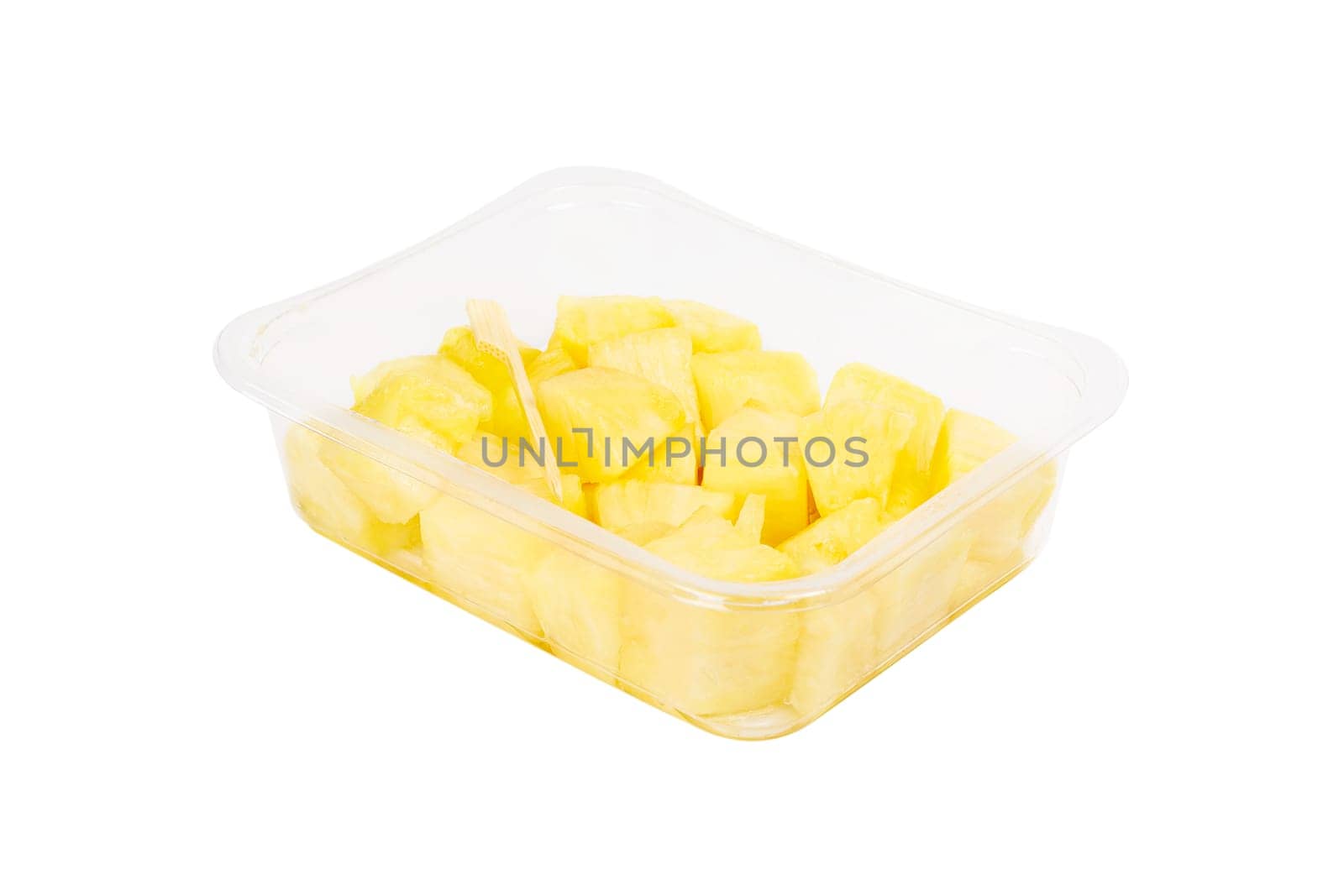 Fruit salad with pineapple in a plastic container on a white background. High quality photo