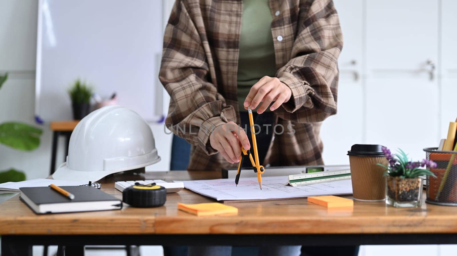 Professional architect woman working on project at modern office.