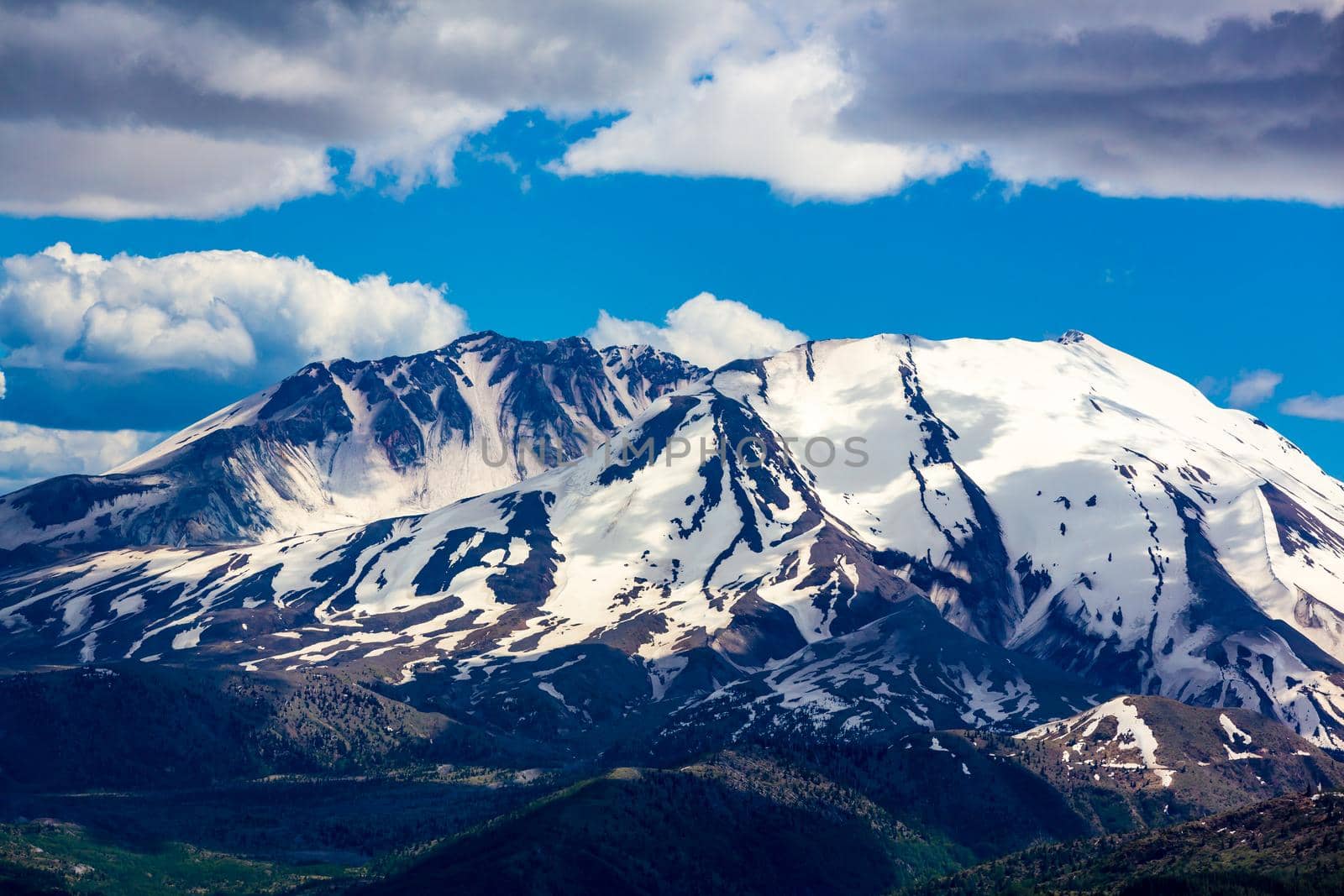Mount St. Helens with some snow patches, in early summer