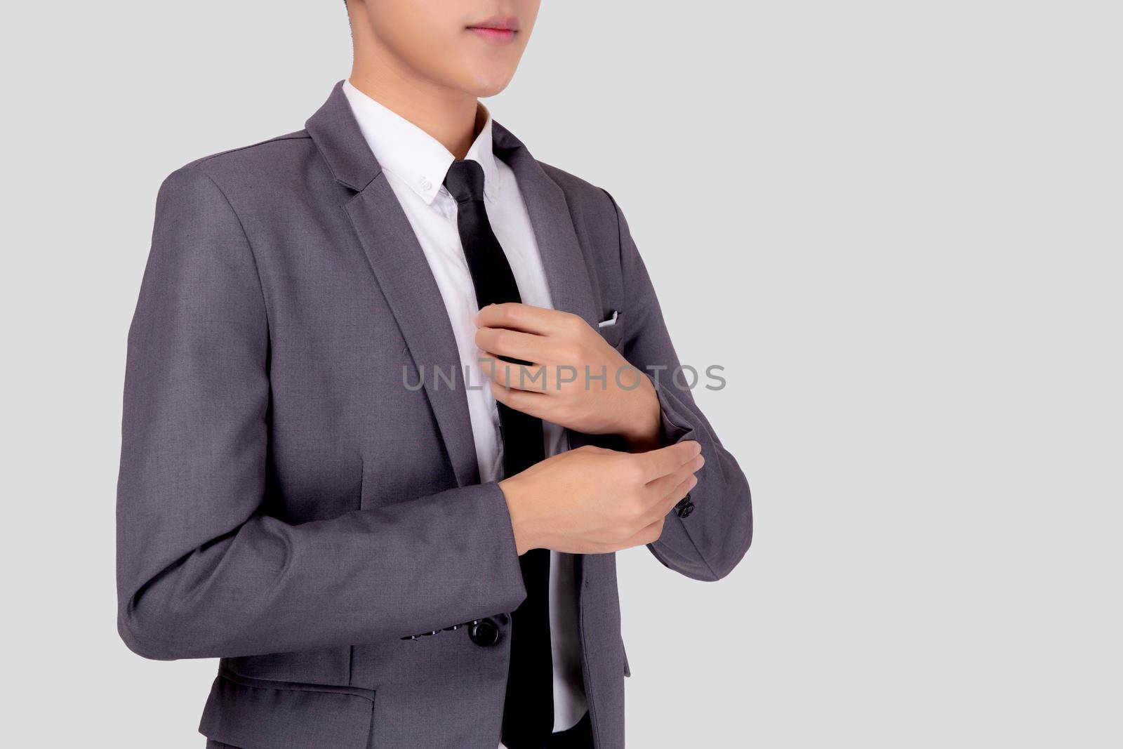 Closeup young asian businessman in suit smiling with confident and friendly isolated on white background, business man smart with success, manager or executive with handsome and leadership.