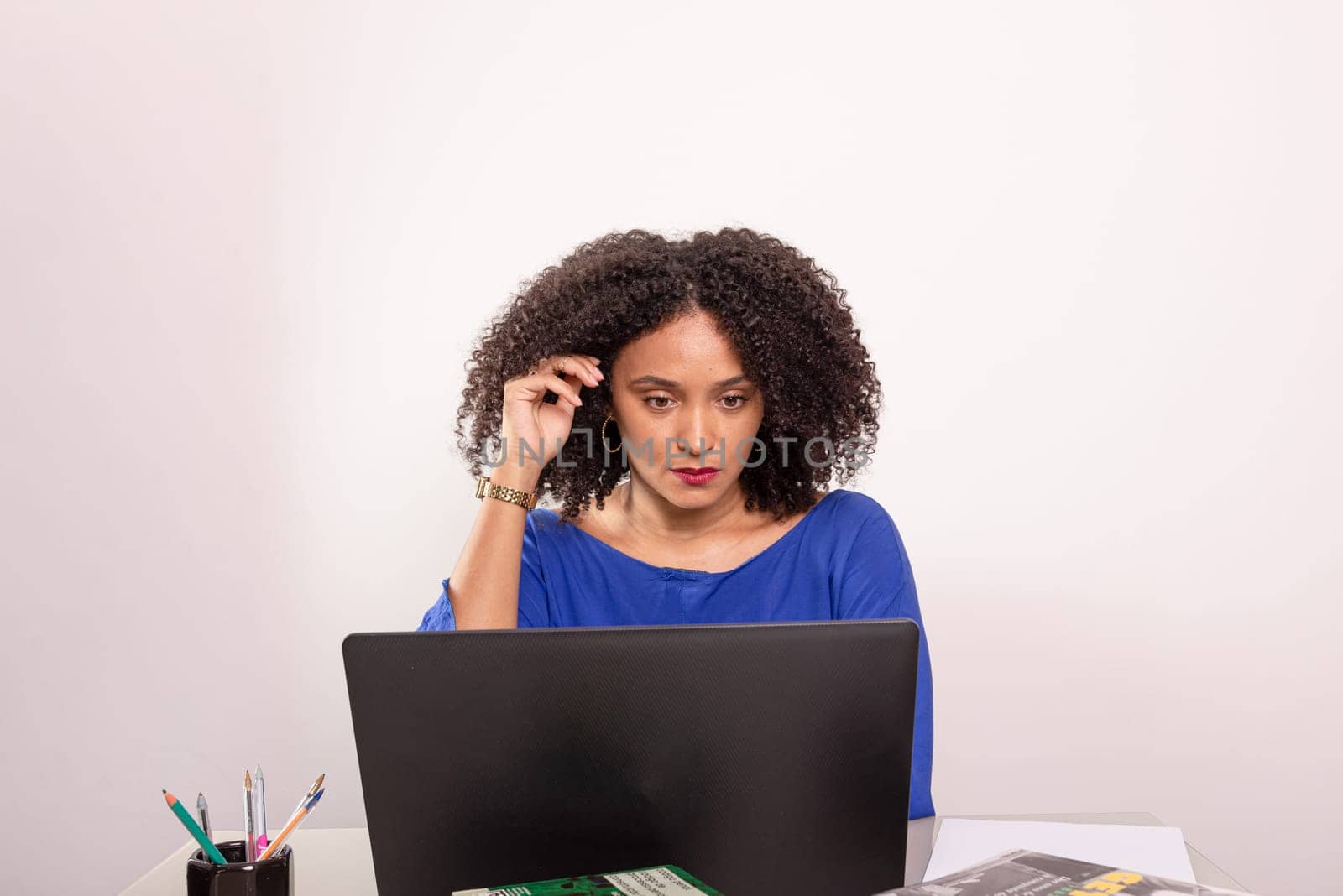 Young pretty businesswoman working on her laptop. Confident ceo concept.