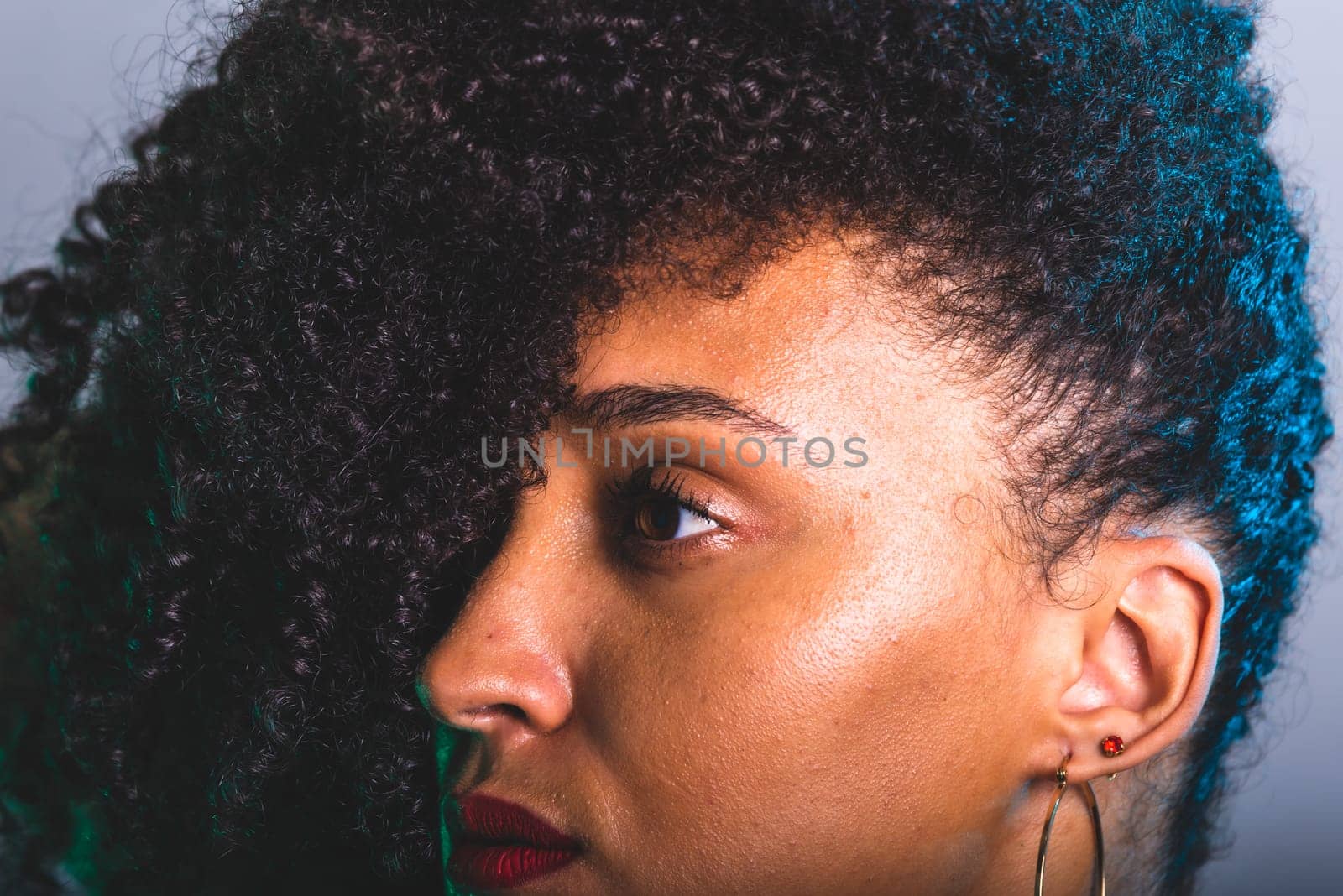 Close-up portrait of beautiful young woman with black hair. studio portrait