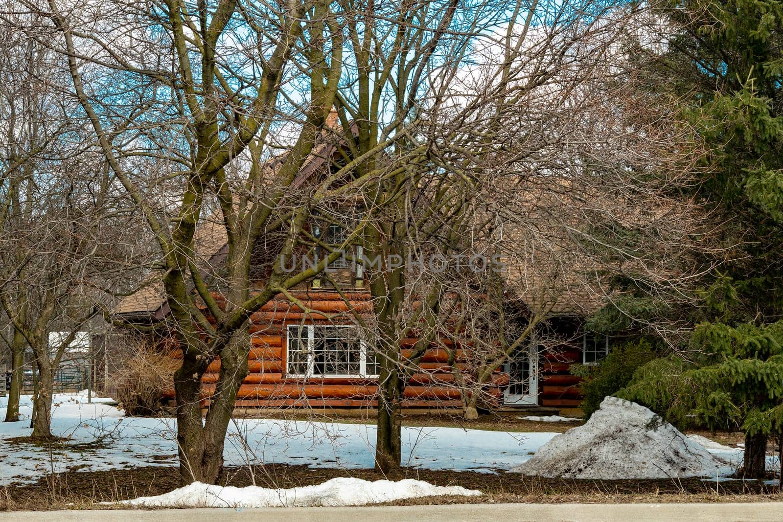 Warm, spring rain gradually washes away the last snow in the city