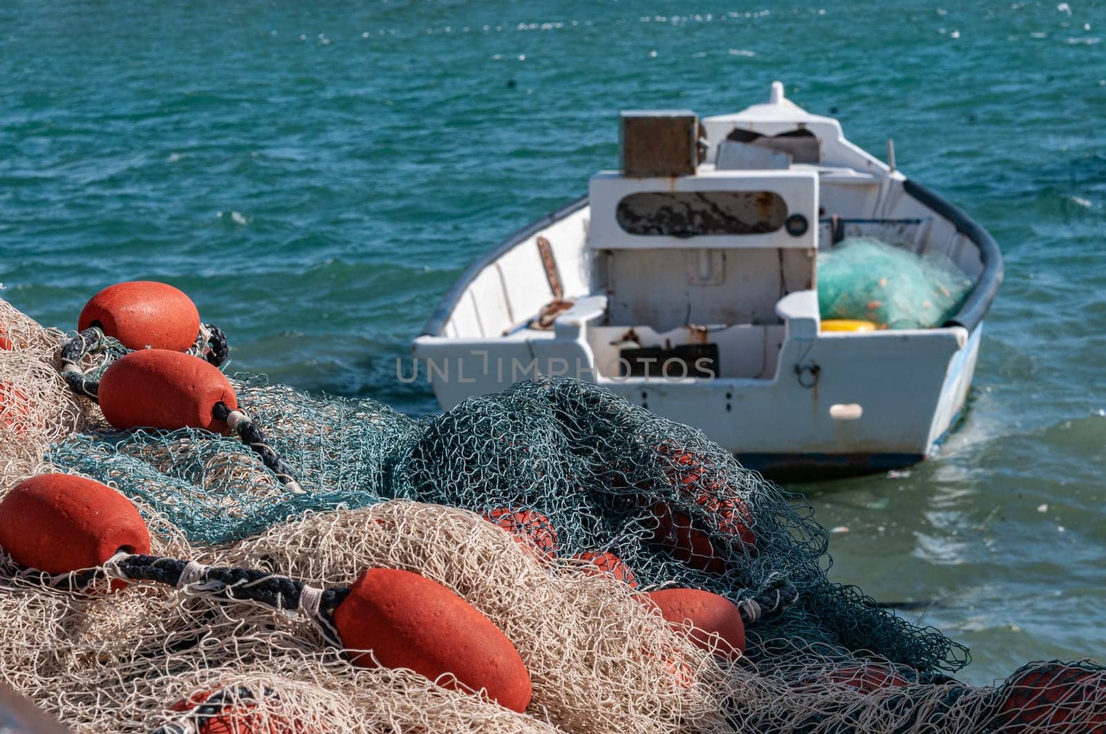 The fishing net lies on the quay by ben44