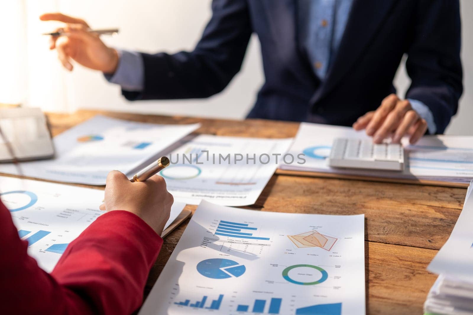Closed up office conference room meeting diverse team of top manager, successful happy business team discussion share idea talking together, Young business group up meeting and pointing to the paper document report figure. High quality photo