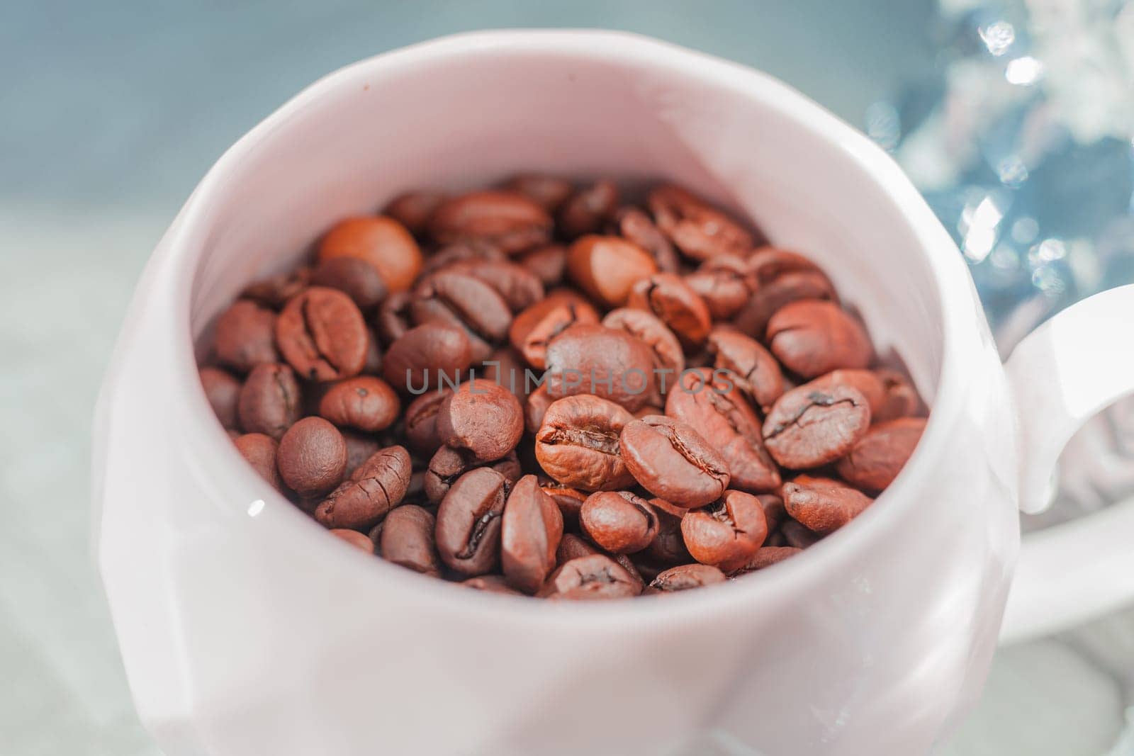 coffee beans in cup on the plate on the table