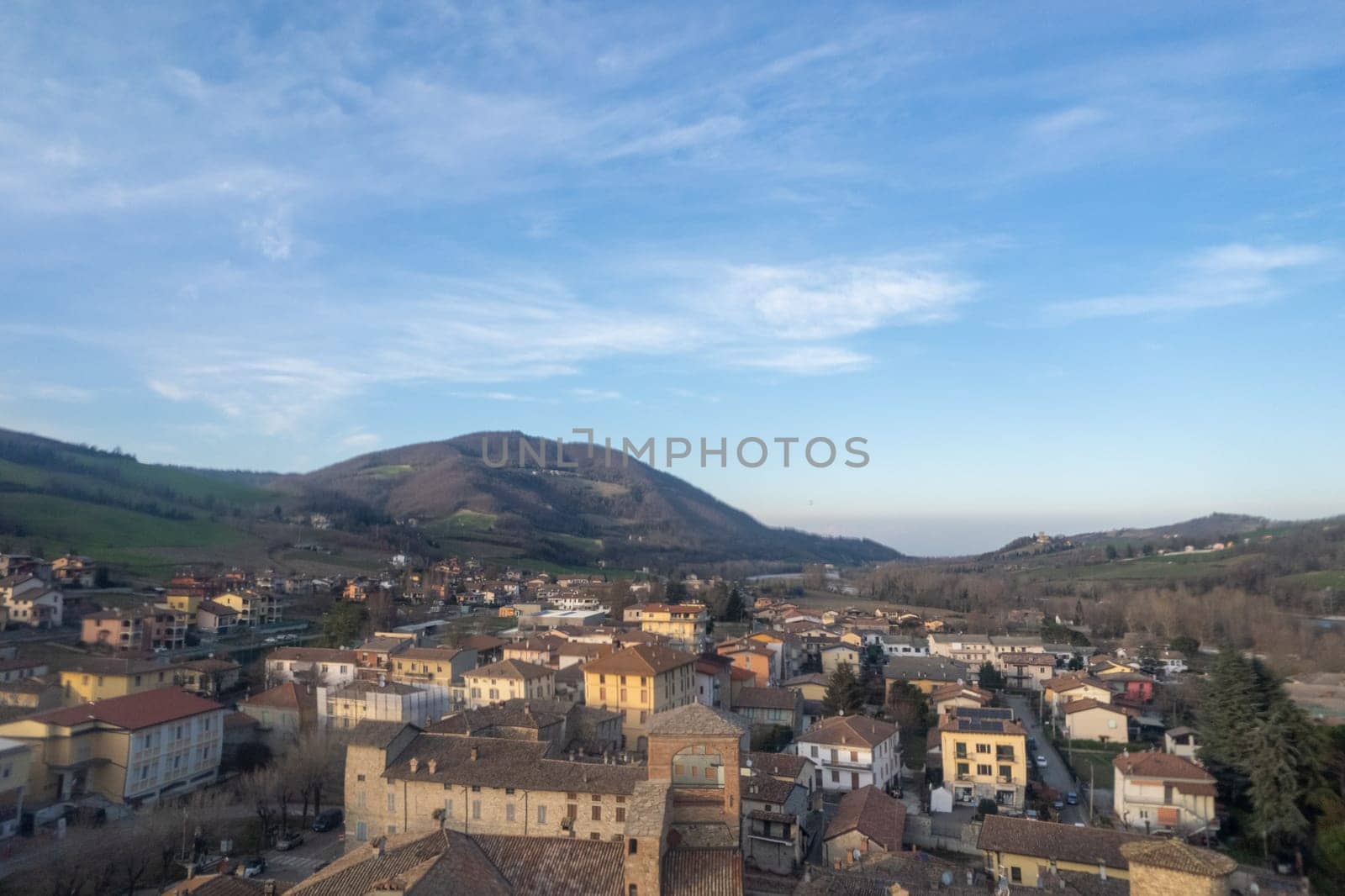 Aerial scenic view of Travo Village, Trebbia river, Valley landscape, Piacenza Italy at sunset