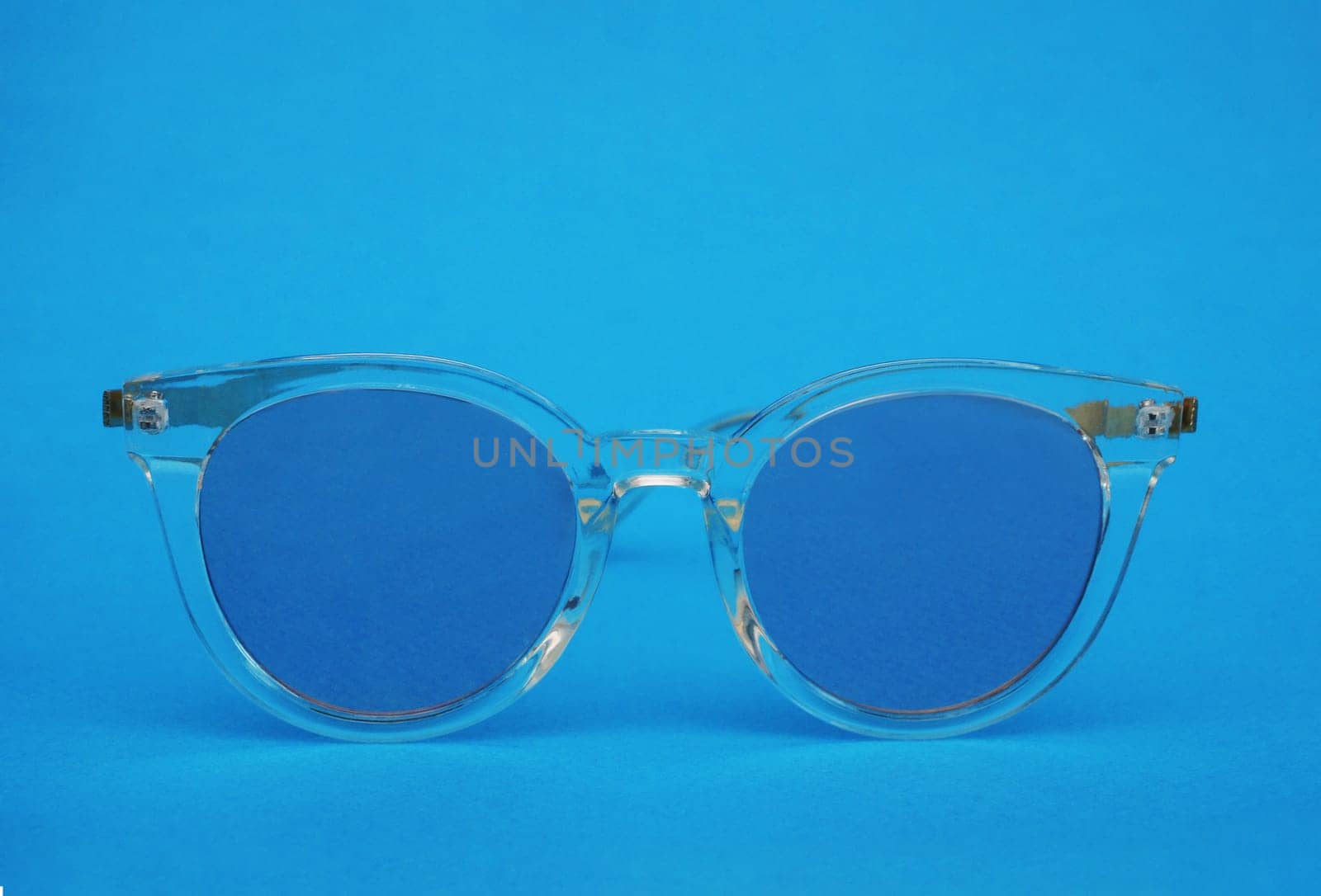 Classic glasses with blue glasses on a blue background. by gelog67