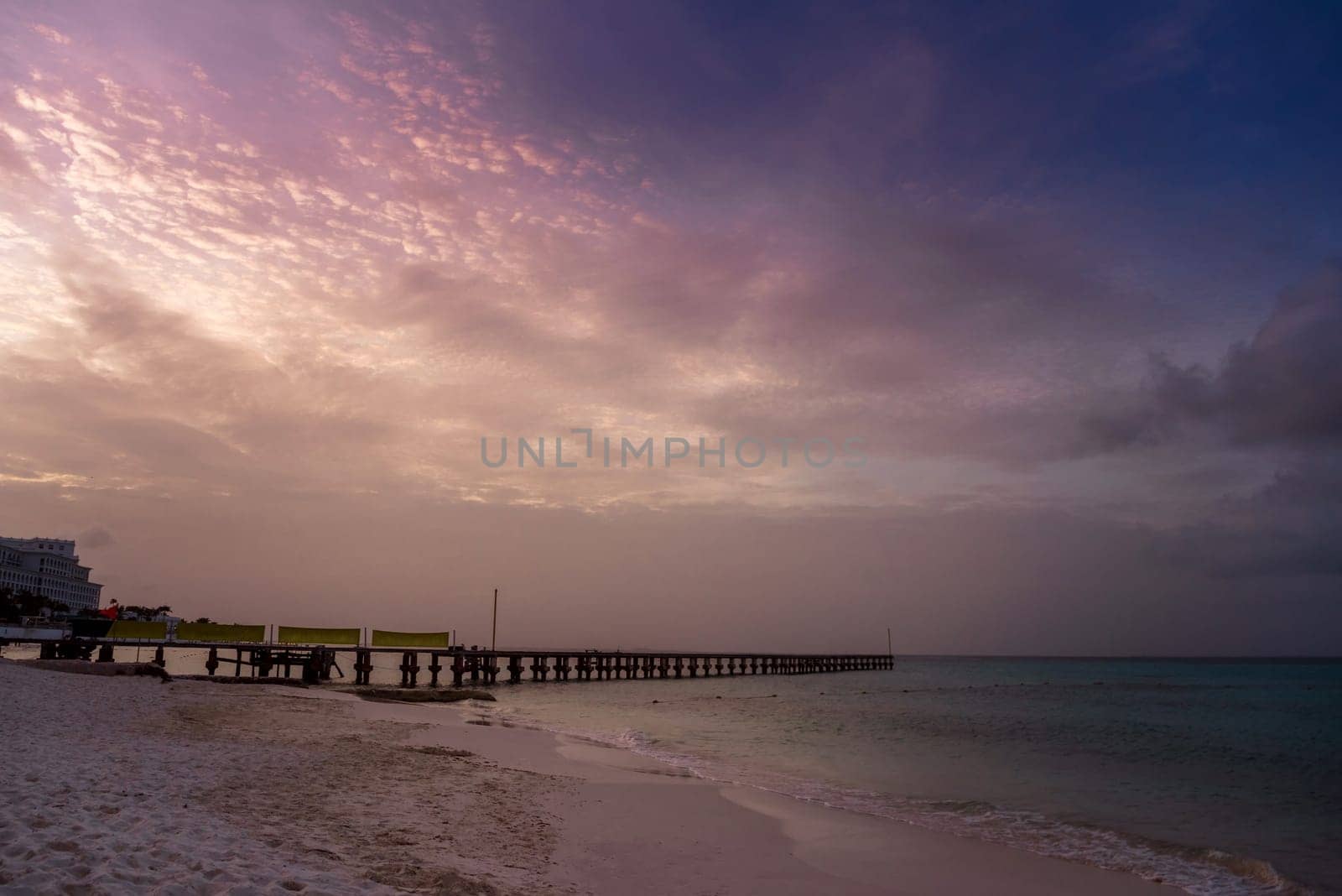 Sea beach with sky sunset or sunrise. Clouds over the sunset sea. Sunset at tropical beach. Nature sunset landscape of beautiful tropical sea.