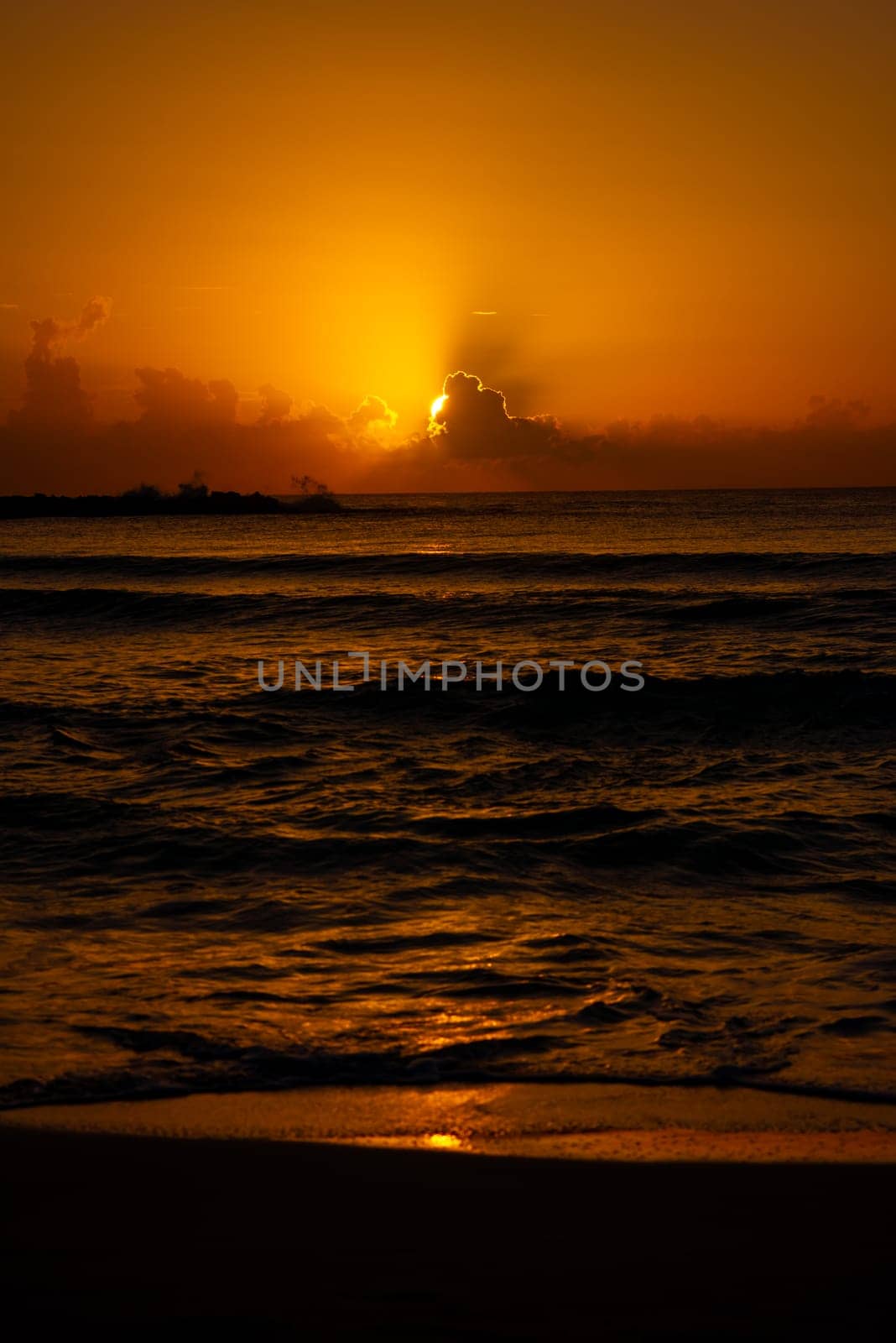 Sea beach with sky sunset or sunrise. Clouds over the sunset sea. Sunset at tropical beach. Nature sunset landscape of beautiful tropical sea.