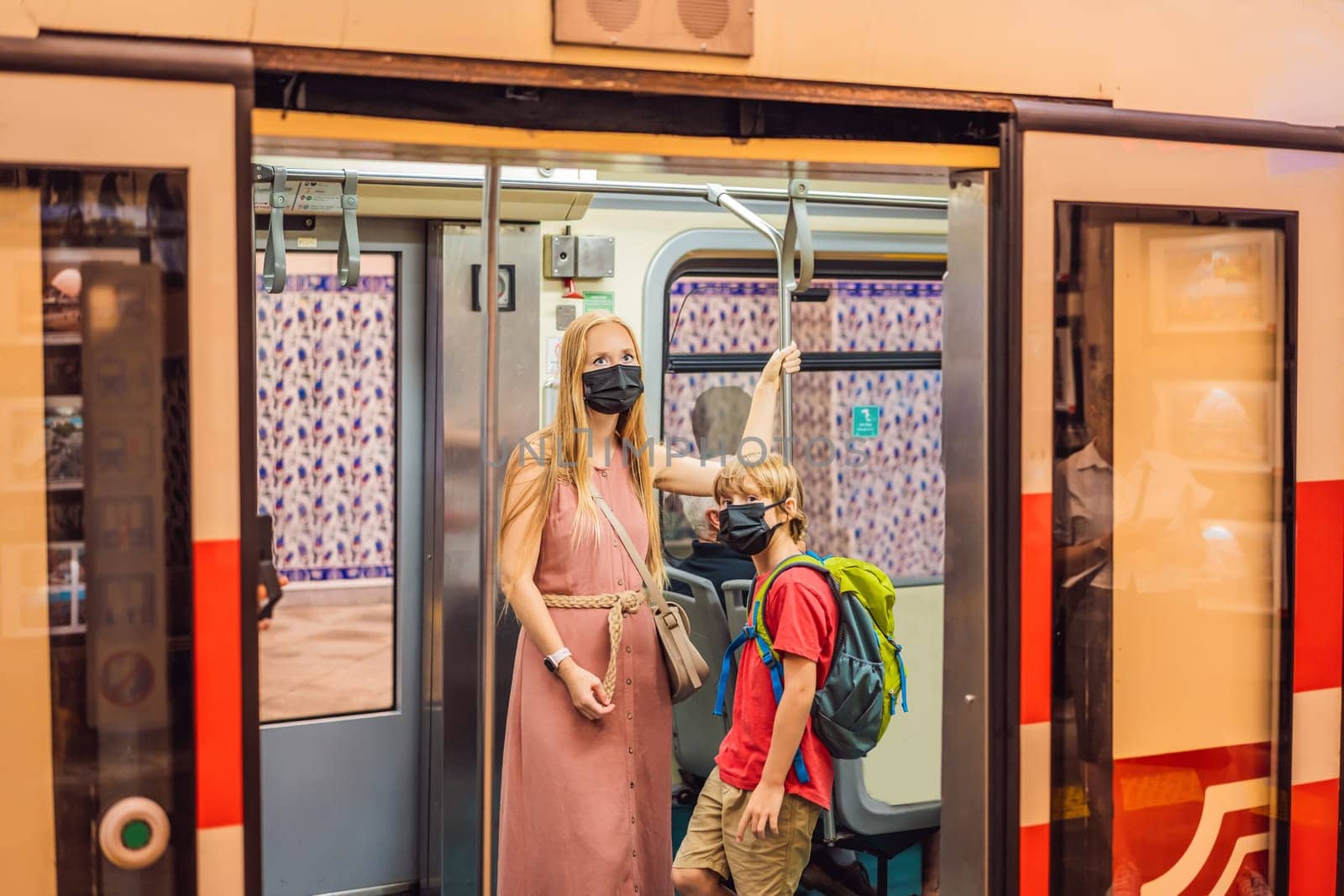 Mom and son tourists on Historical tunnel funicular train in Istanbul.