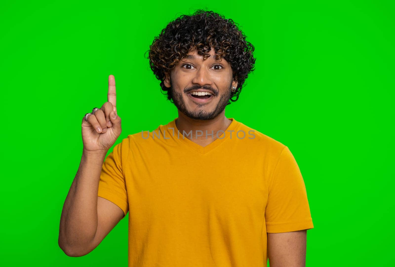 Eureka. Inspired young indian man pointing finger up with open mouth, having good idea, plan, startup, showing inspiration motivation gesture, problem solution. Hindu guy on chroma key background
