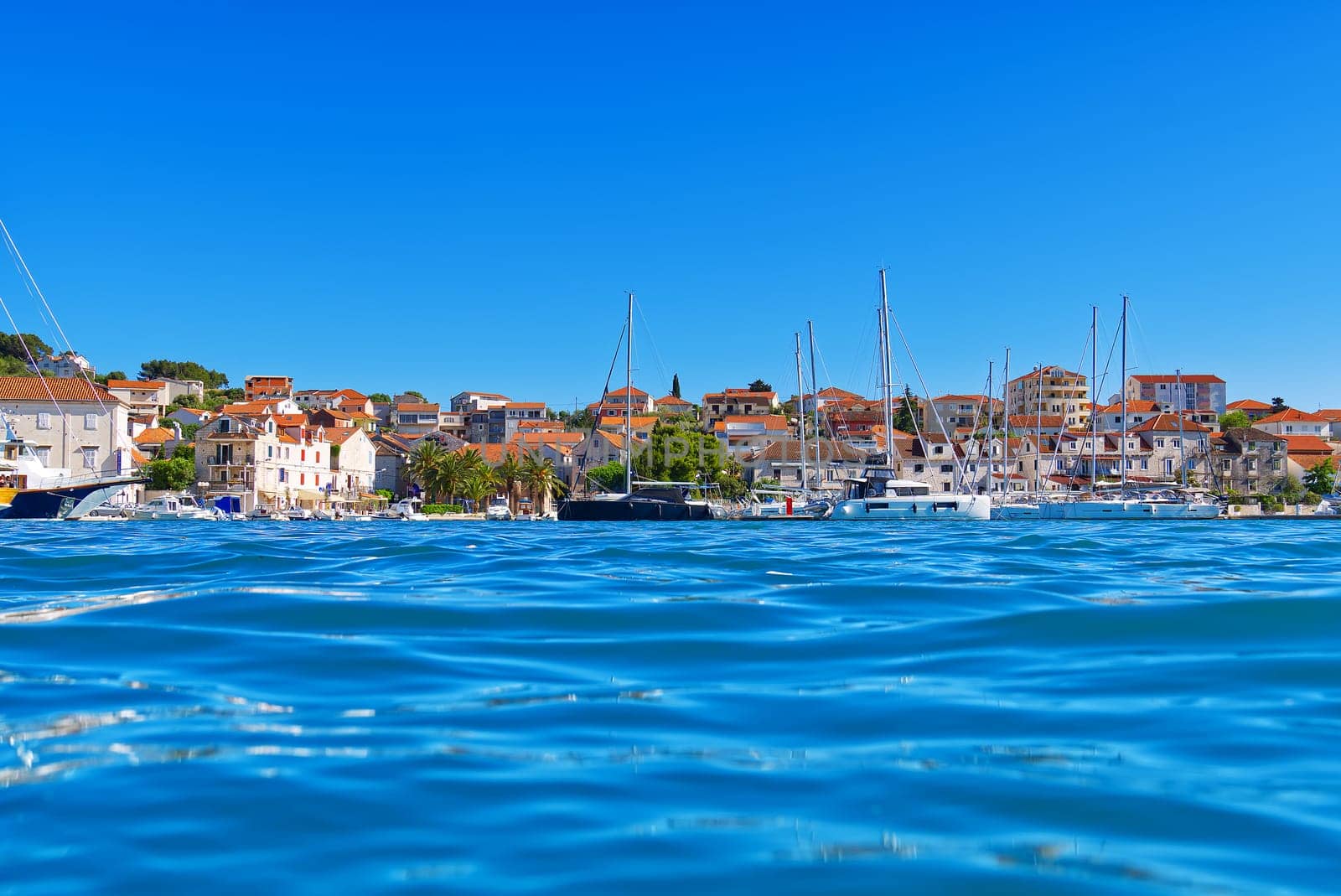 Trogir town panoramic view. UNESCO world heritage site panoramic view in Dalmatia, Croatia, tourist destination. View of sea coast in Trogir town with colorful houses