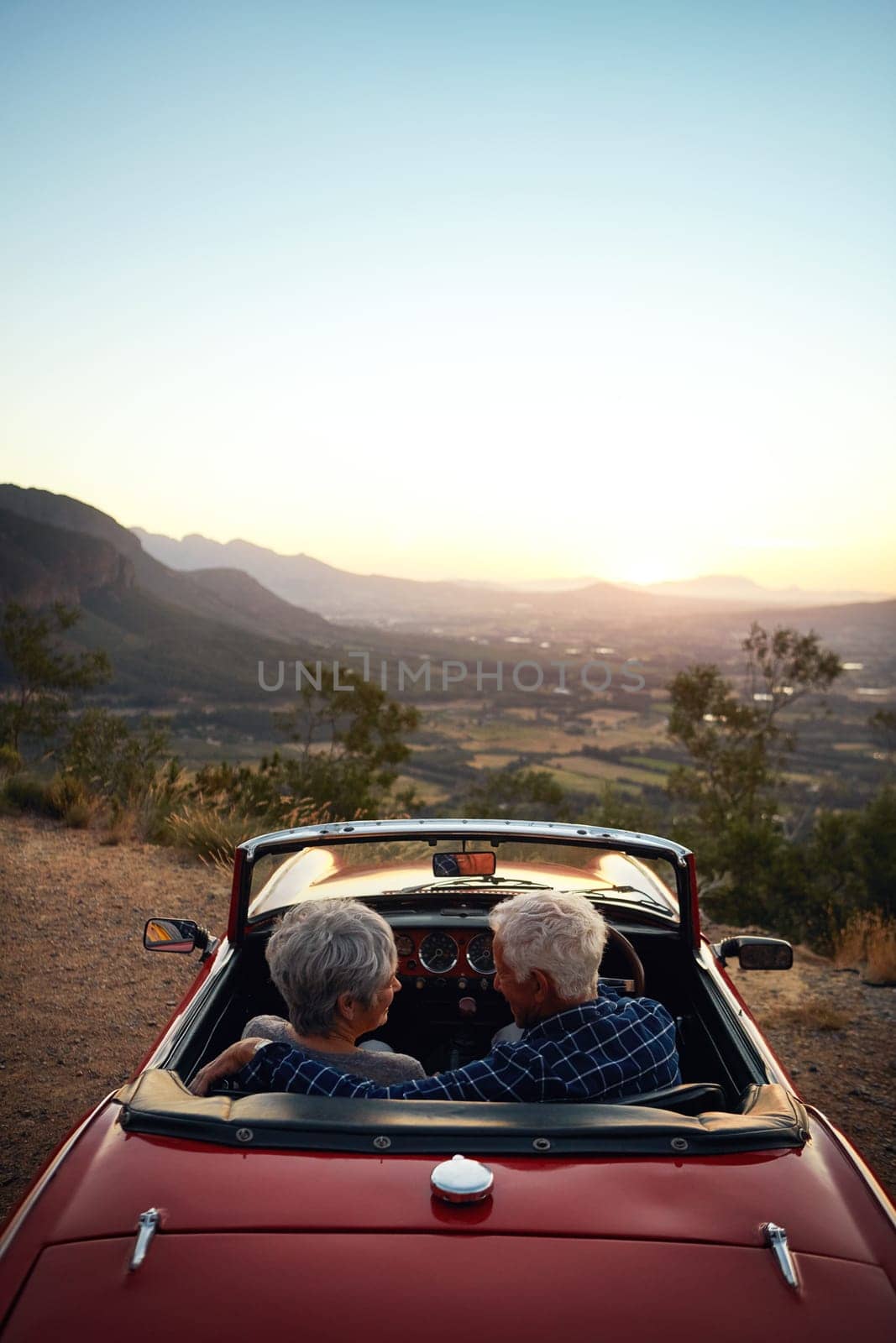 So many places left unexplored. a senior couple enjoying a road trip. by YuriArcurs