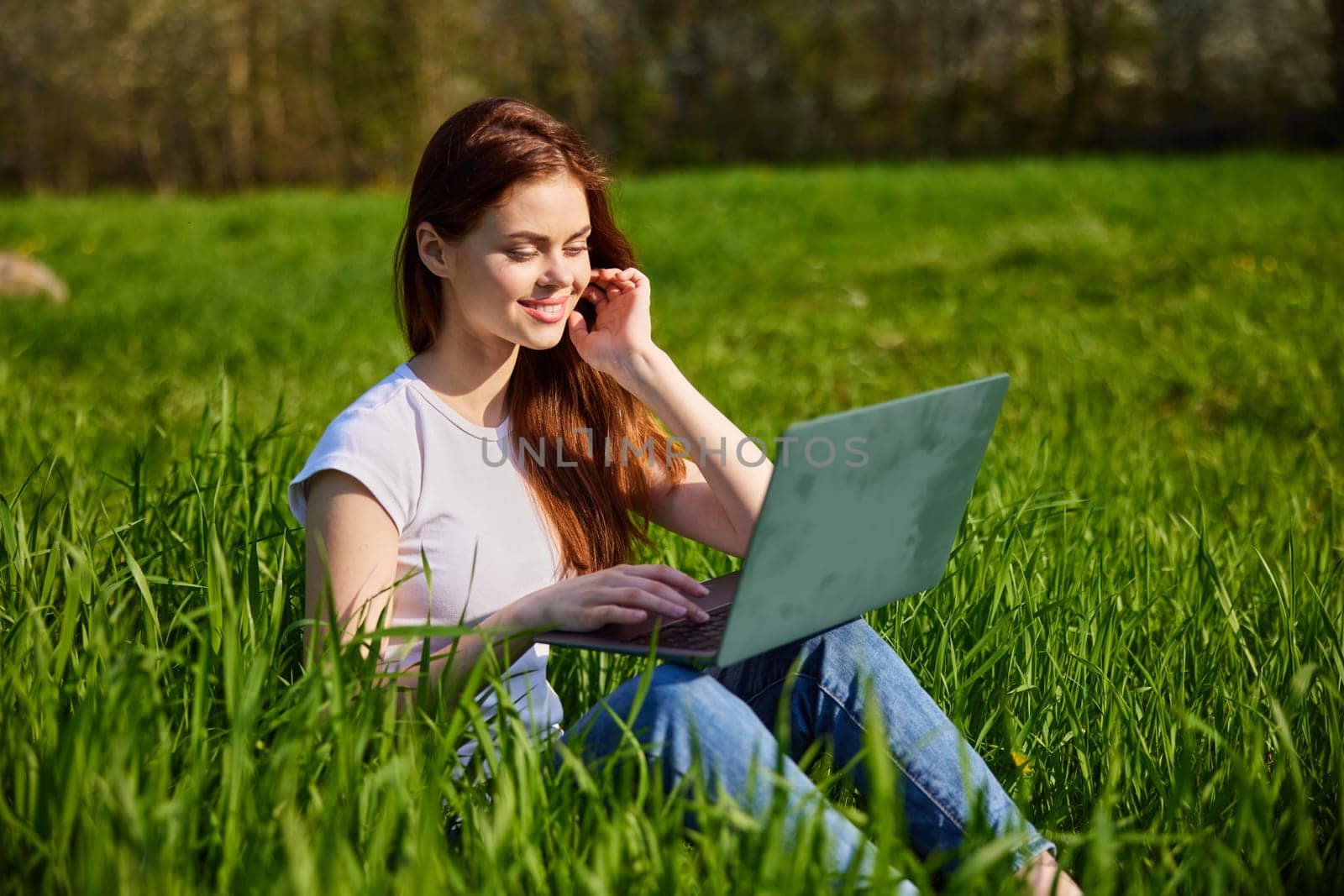 woman with laptop outdoors. High quality photo