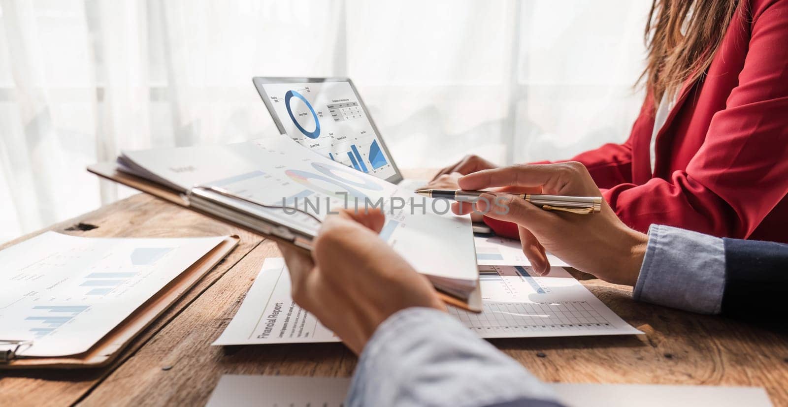 Business People Meeting using laptop computer,calculator,notebook,stock market chart paper for analysis Plans to improve quality next month. Conference Discussion Corporate Concept. by wichayada