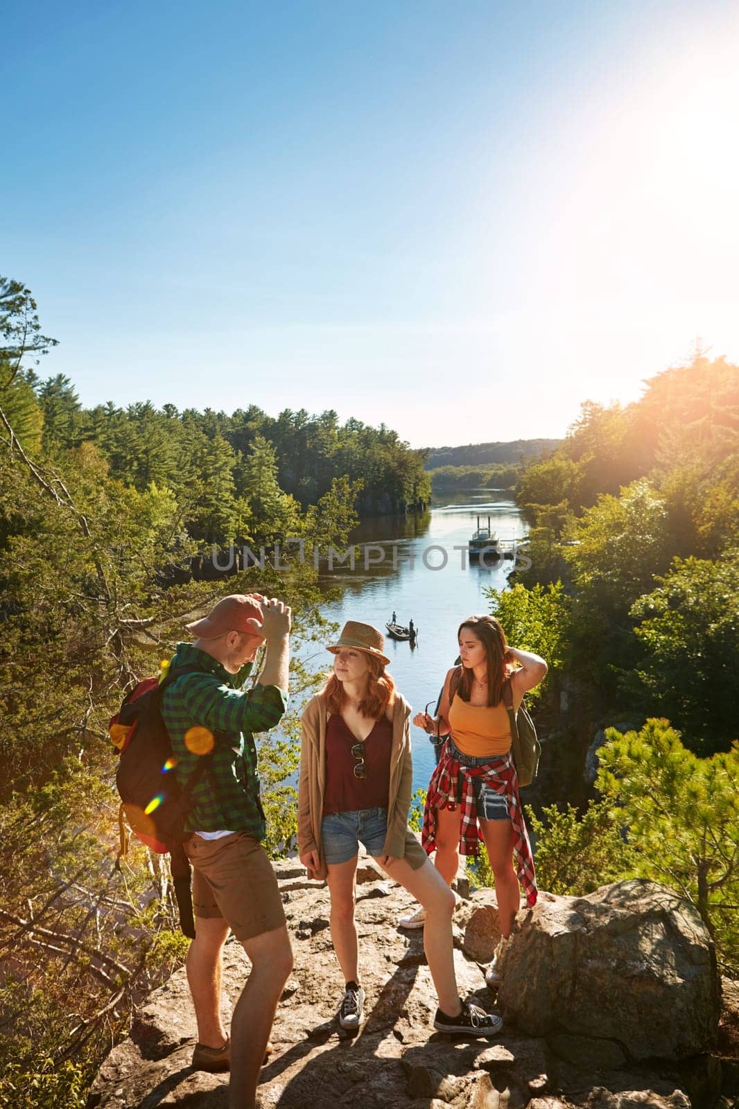 We prefer being out in nature. three friends out hiking in the mountains