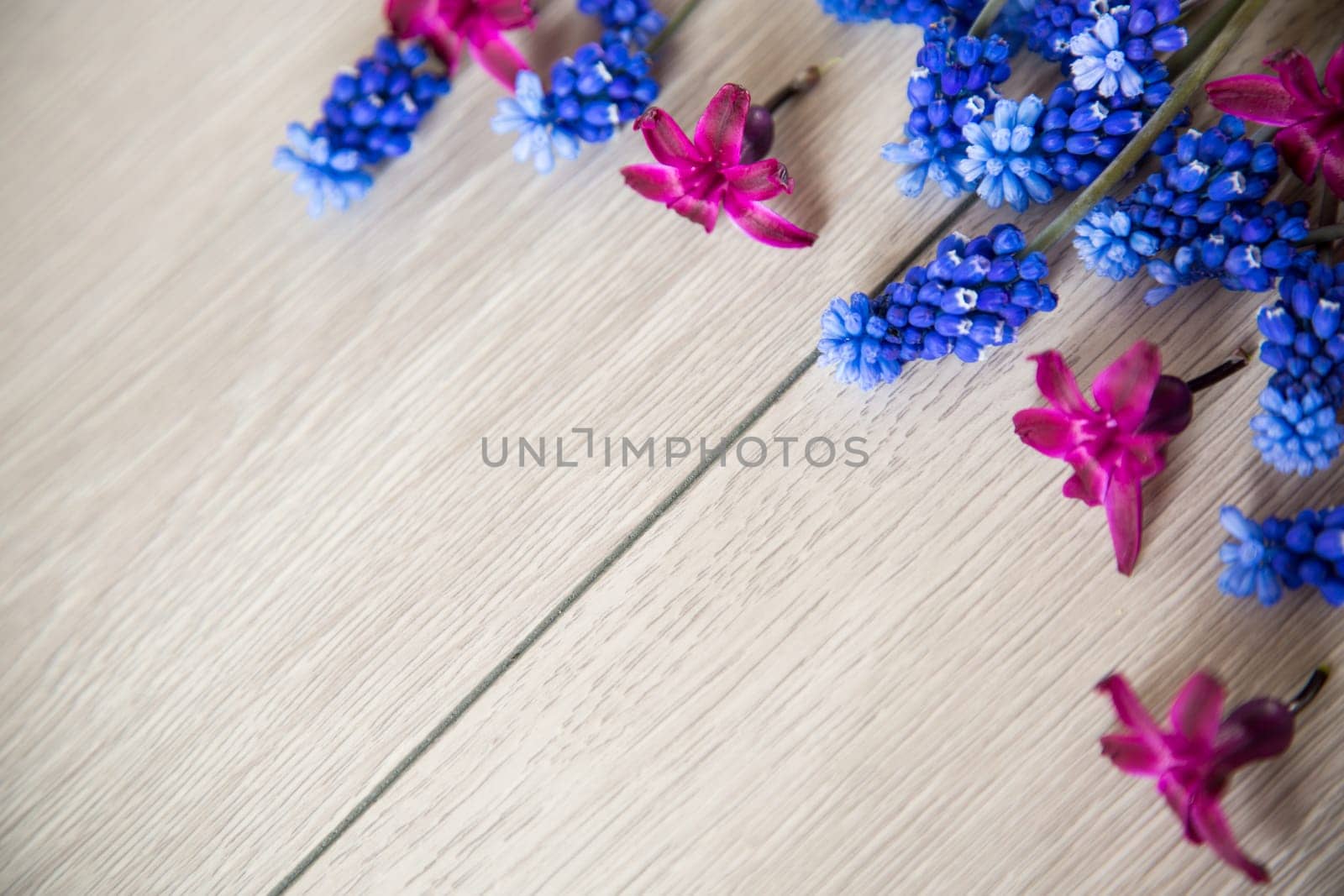 beautiful bouquet of spring flowers on a wooden table, rustic style.