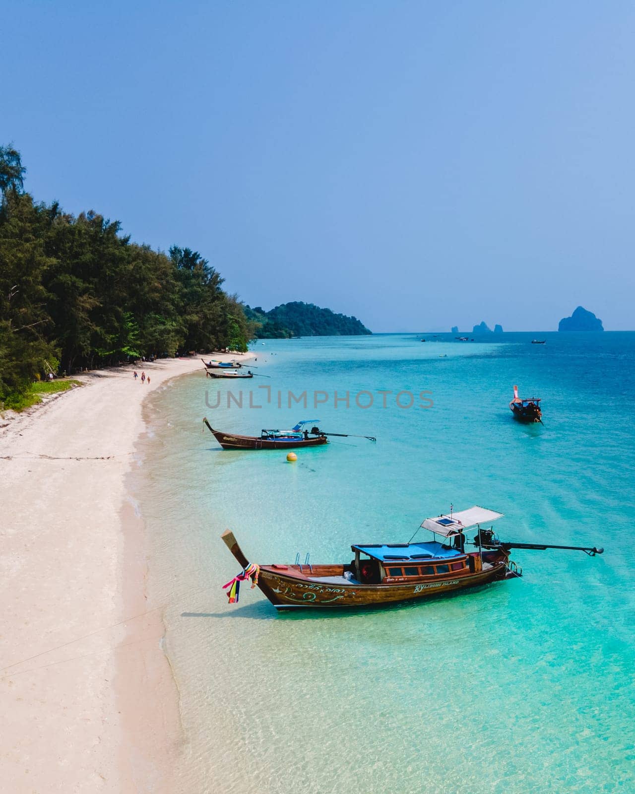 Koh Kradan Island with a white tropical beach and turqouse colored ocean. aerial view of the beach of Koh kradan view from drone