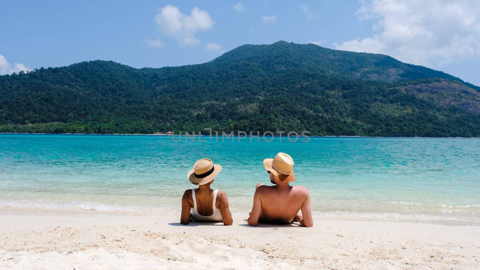 Couple on the beach of Koh Lipe Island Thailand, tropical Island with a blue ocean and white soft sand by fokkebok