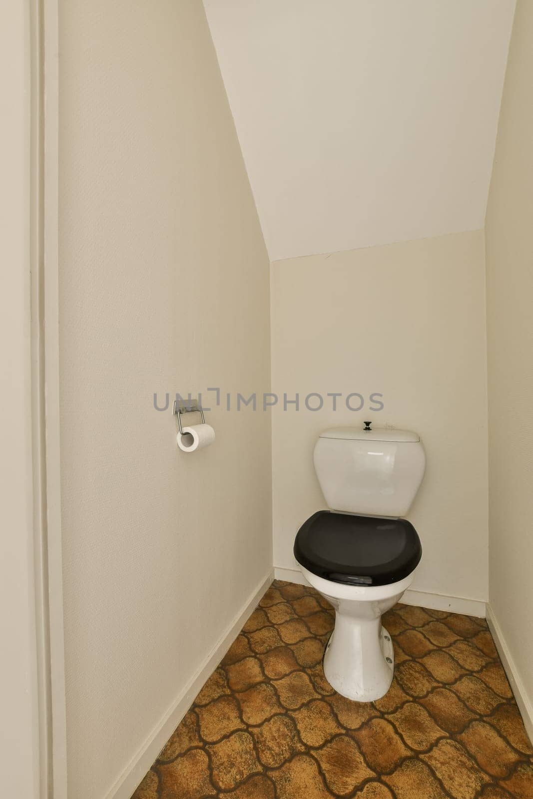a bathroom with a toilet and a roll of toilet by casamedia