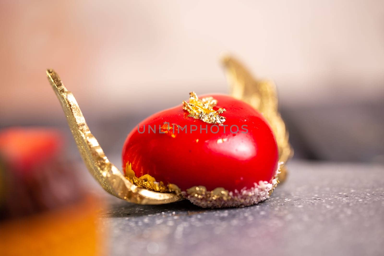 red dessert in the shape of a heart with wings.