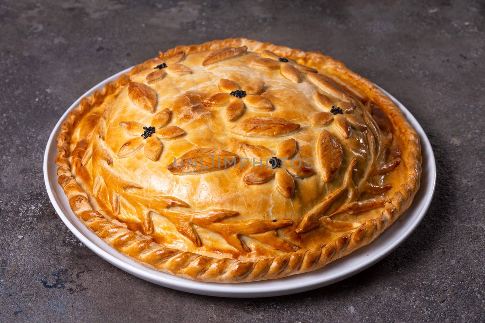 hot homemade chicken pie with filling. pie on the table.