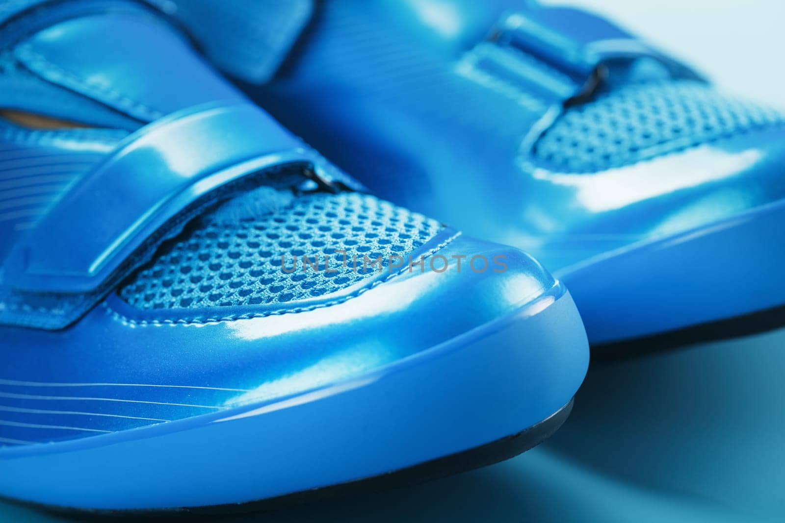 Blue bicycle shoes on a blue background by AlexGrec