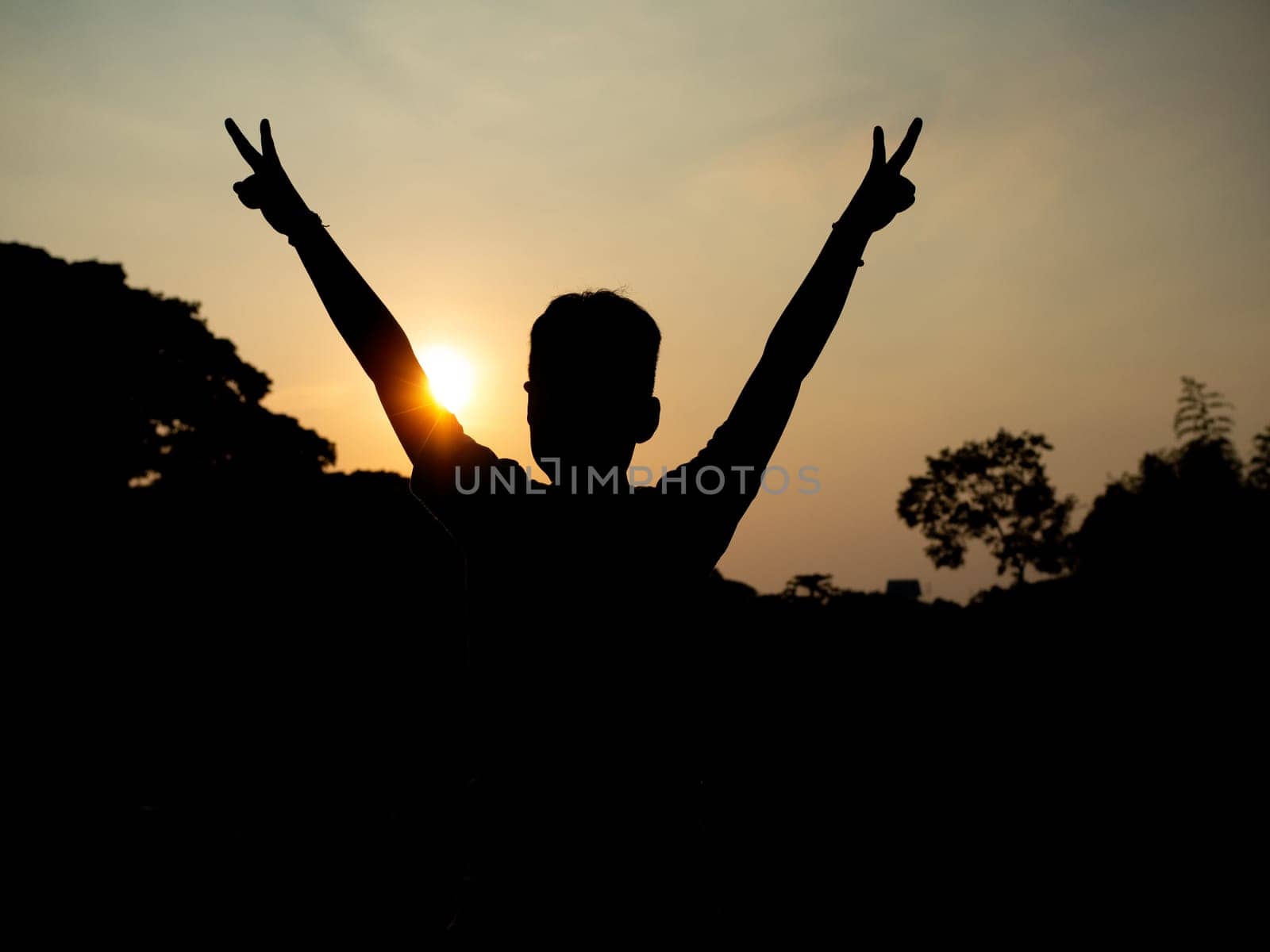 Back of man with sun background. freedom feeling. new beginning