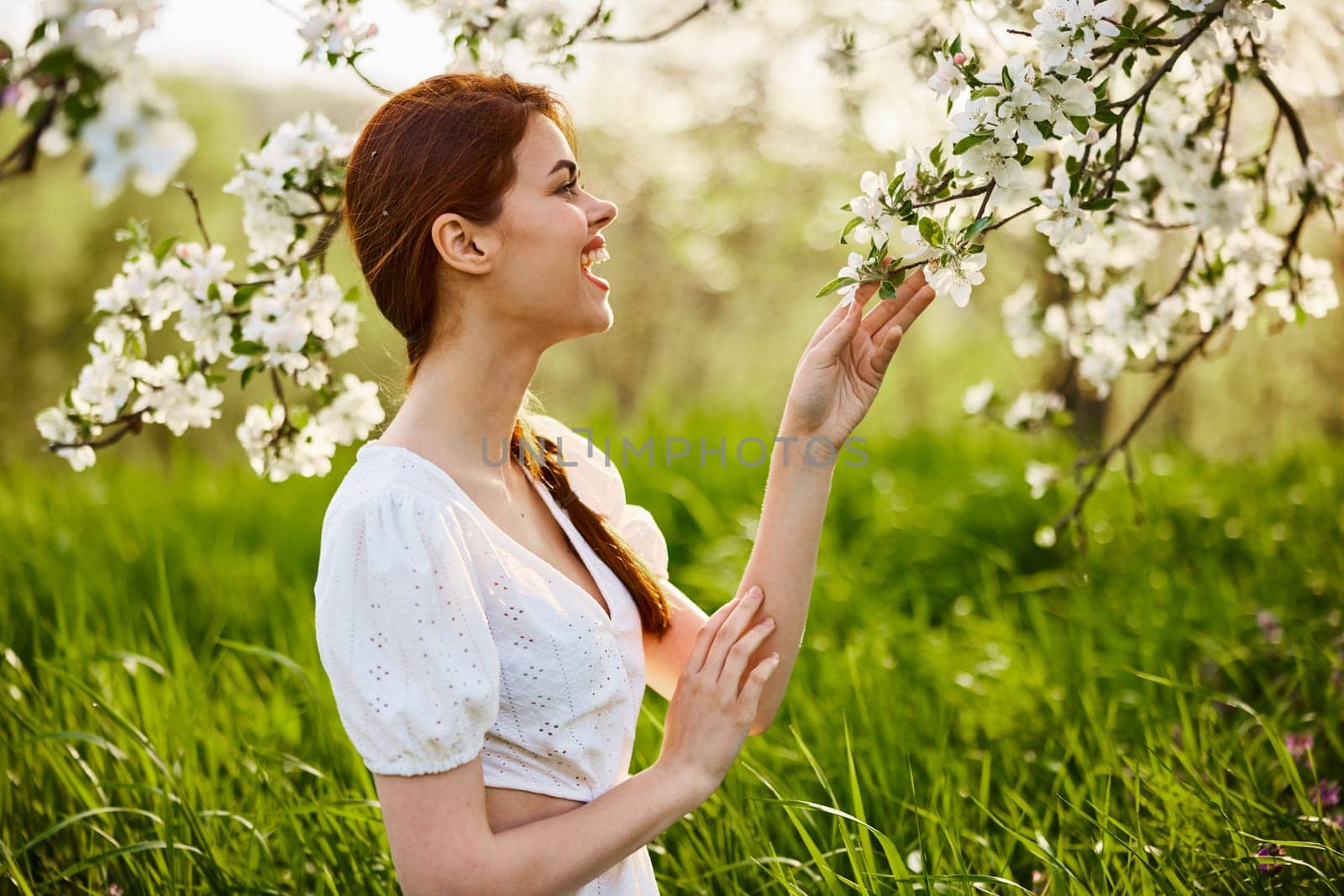 spring , summer beauty portrait of red head woman in light dress. High quality photo