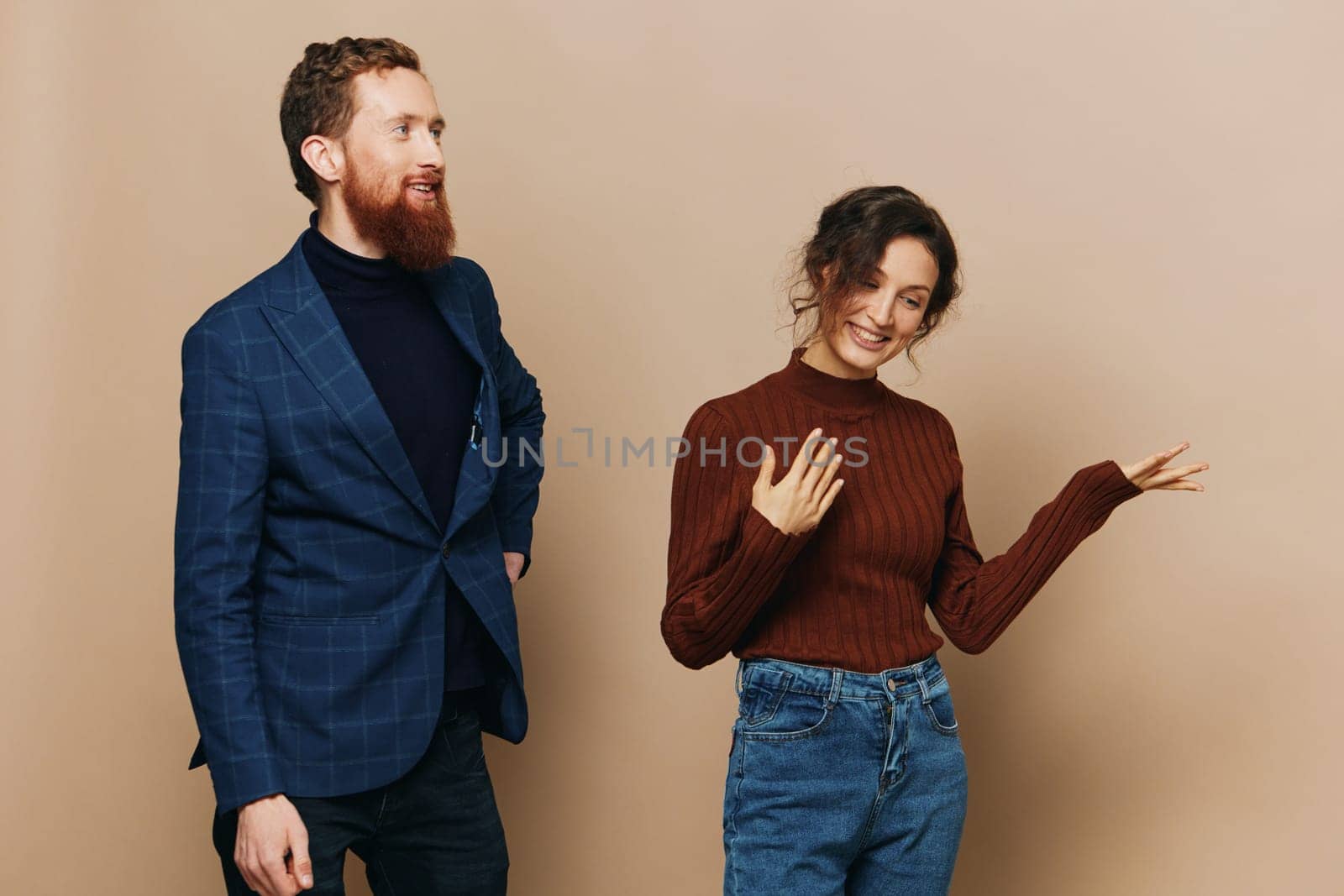 Man and woman couple in a relationship smile and interaction on a beige background in a real relationship between people by SHOTPRIME