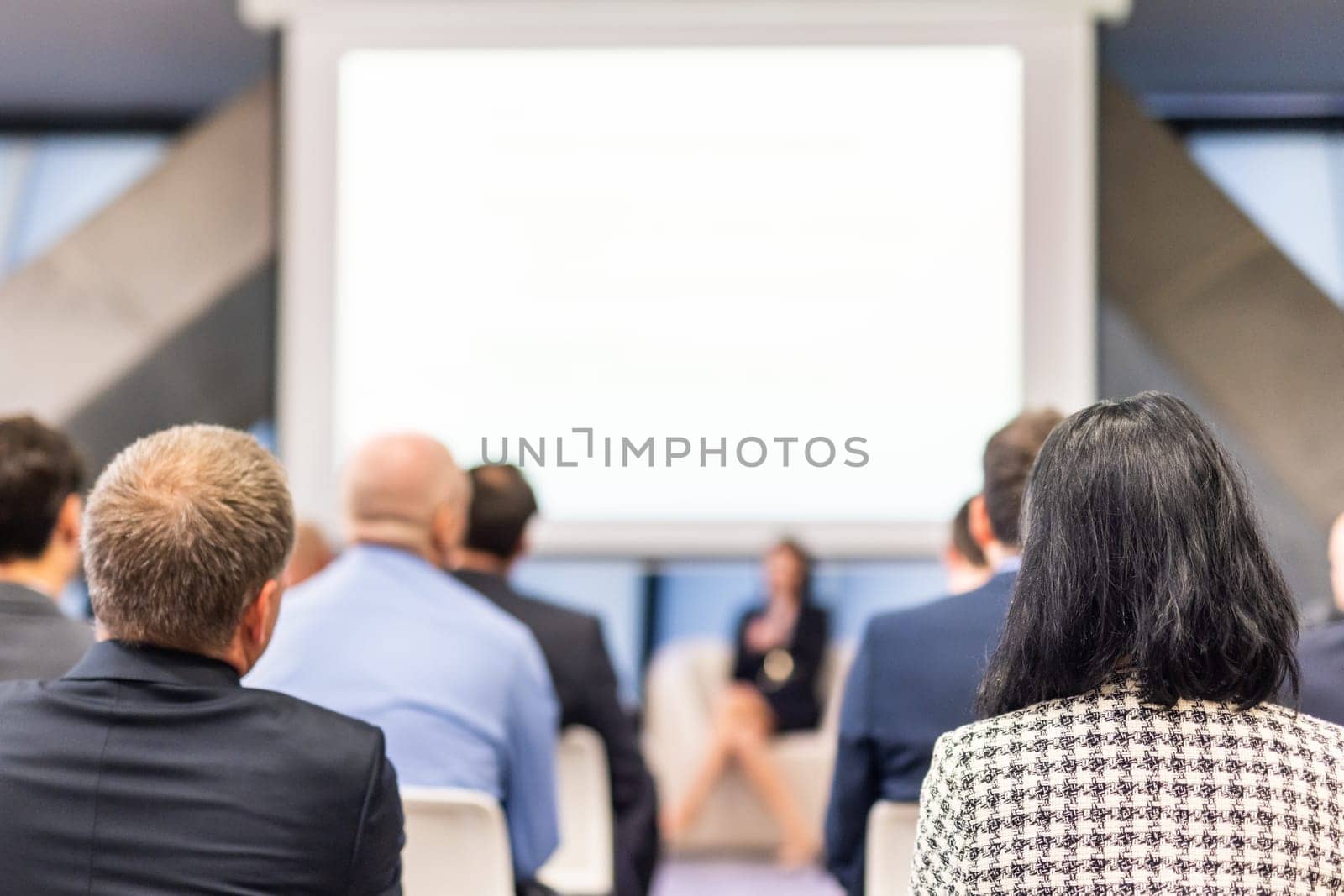 Woman giving presentation on business conference event. by kasto