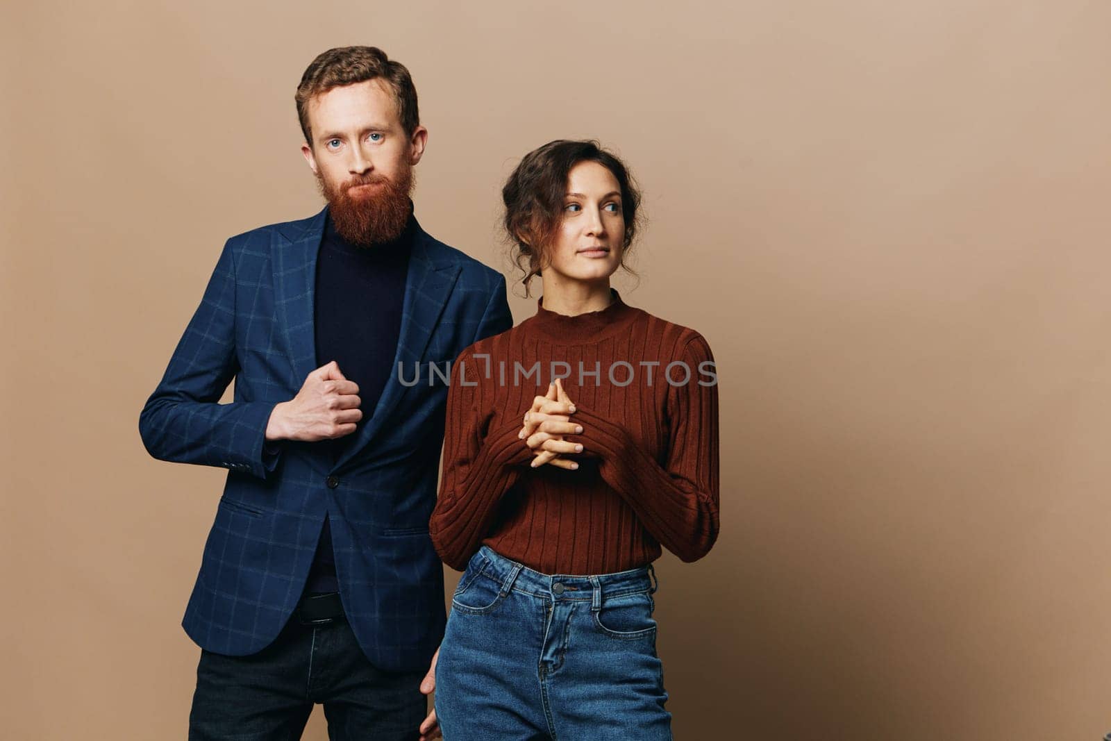 Man and woman couple in a relationship smile and interaction on a beige background in a real relationship between people by SHOTPRIME