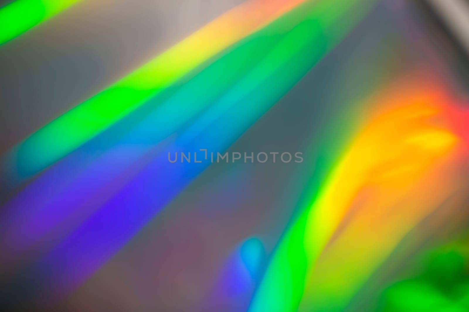 Rainbow holographic bokeh background. Multicolored overflows of color.