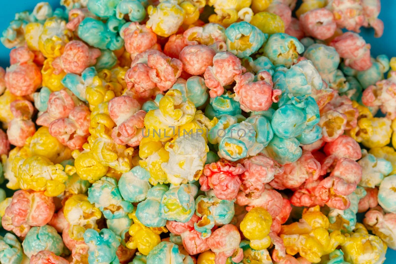 Multicolored popcorn close-up. Colorful beautiful sweet dessert.
