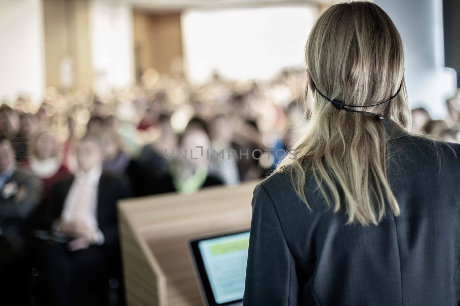 Female speaker at Business Conference and Presentation. Audience at the conference hall. Business and Entrepreneurship. Business woman.