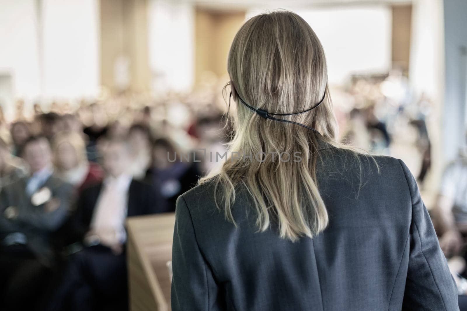 Female speaker at Business Conference and Presentation. Audience at the conference hall. Business and Entrepreneurship. Business woman.