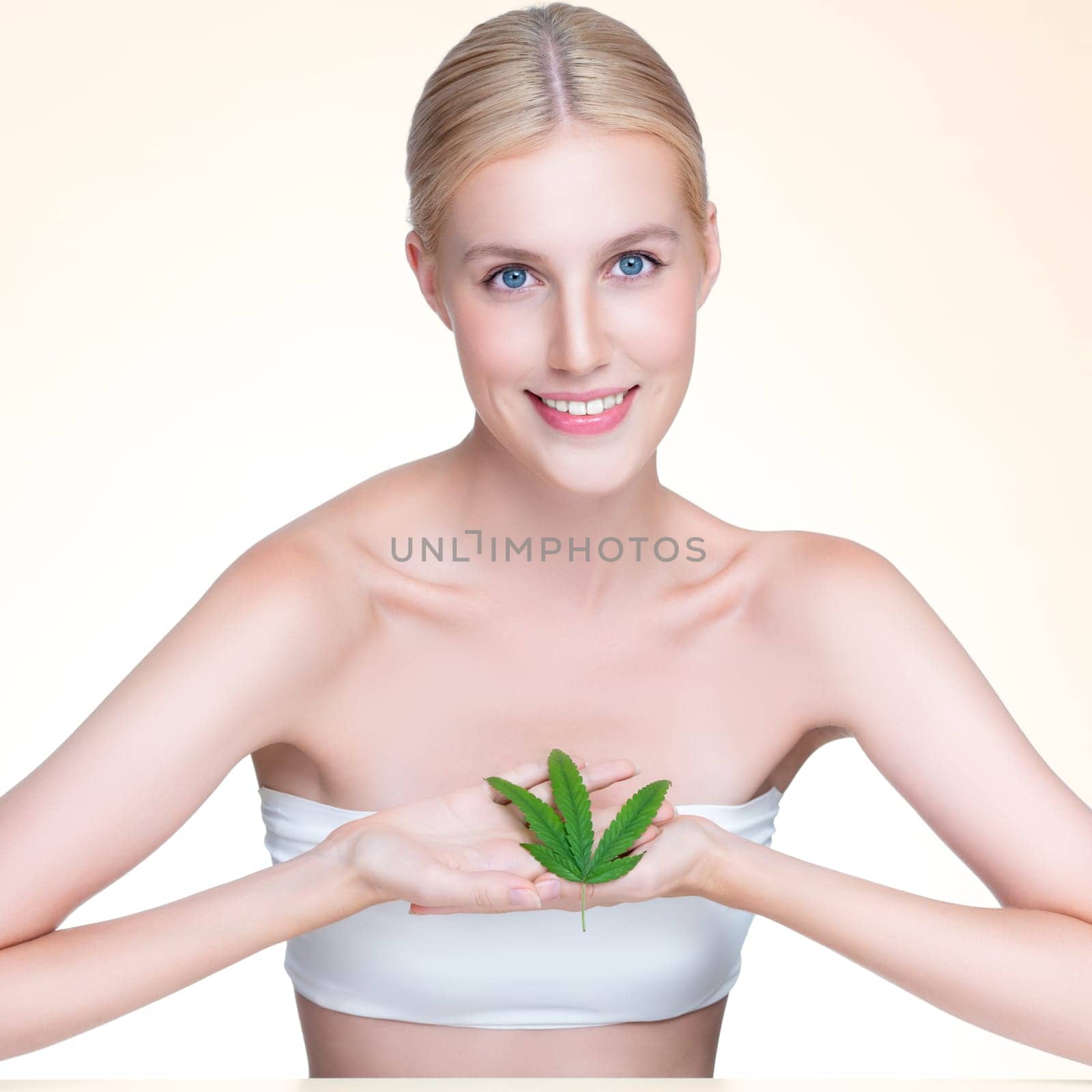 Personable woman hold green leaf as cannabis beauty concept. by biancoblue