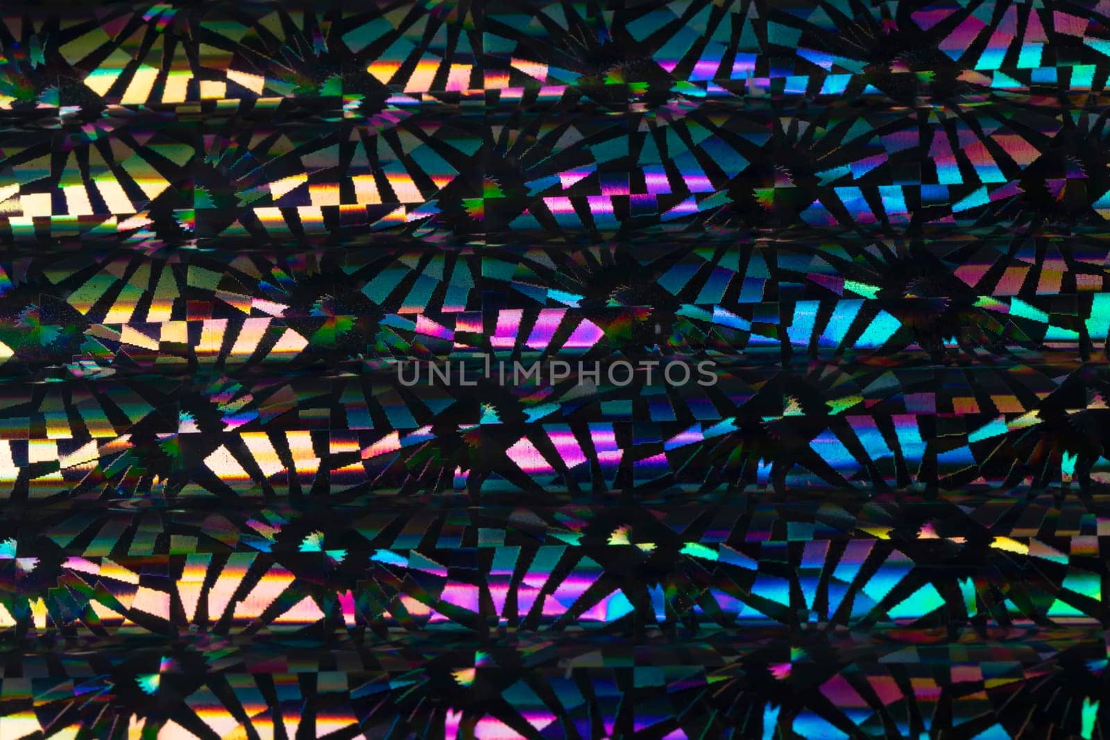 Iridescent holographic metal foil background. Background shiny