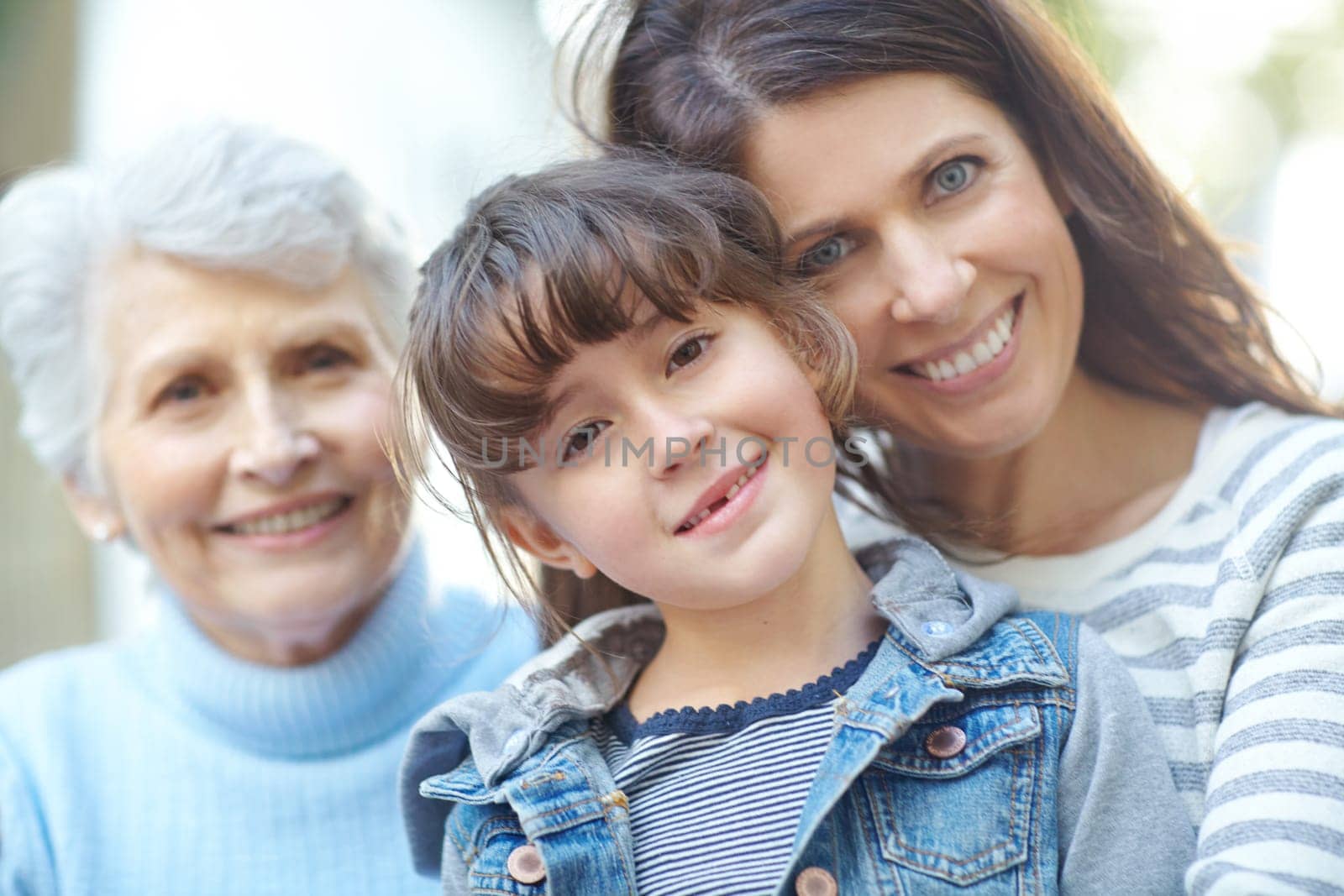 Family over everything. Portrait of a three generational family sitting outdoors