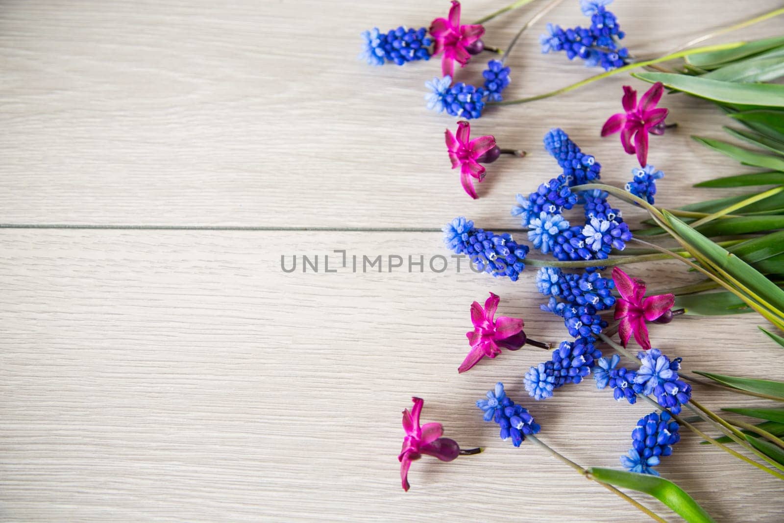 beautiful bouquet of spring flowers on a wooden table, rustic style.