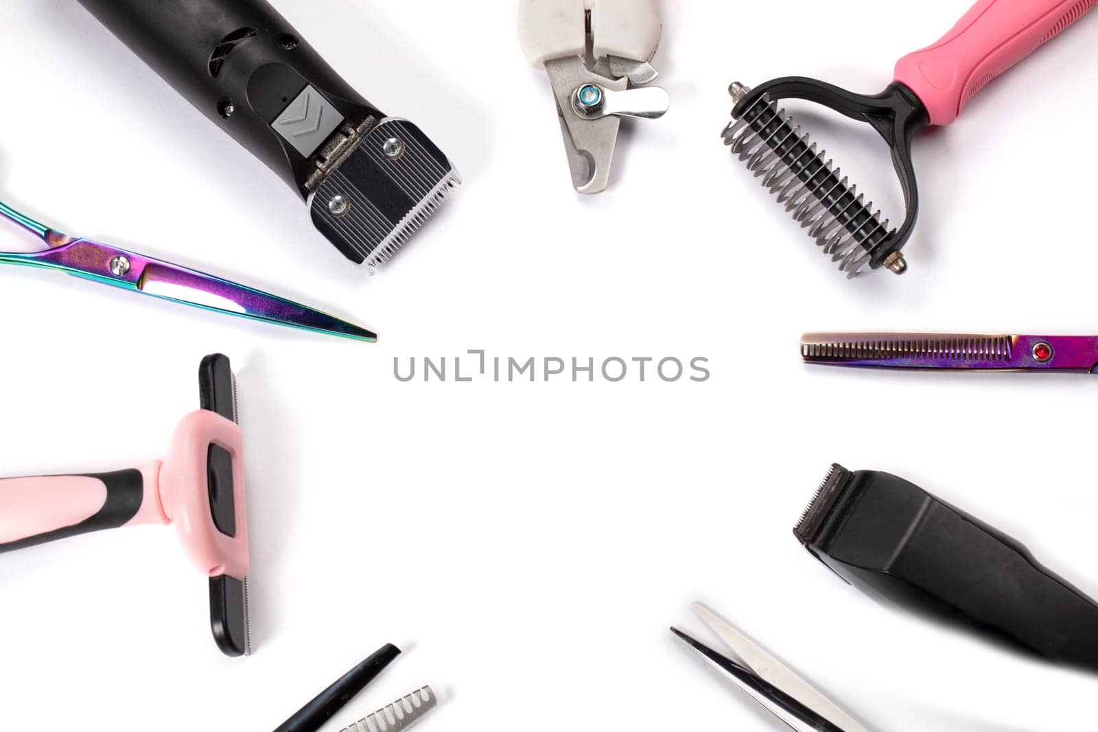 Tool for the groomer on a white background. Dog grooming accessories. Scissors for cutting animals. View from above