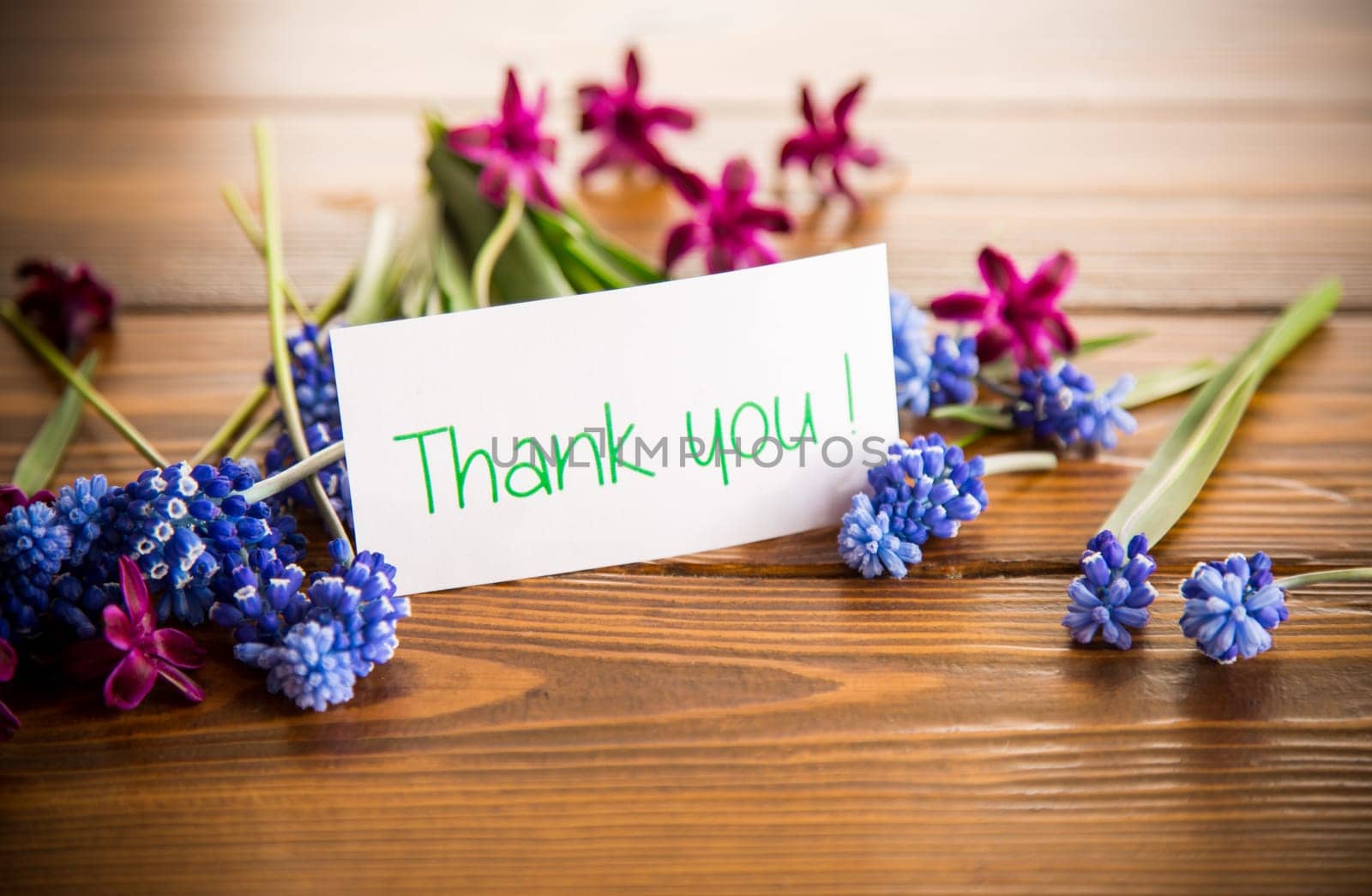 beautiful bouquet of spring flowers on a wooden table, rustic style.