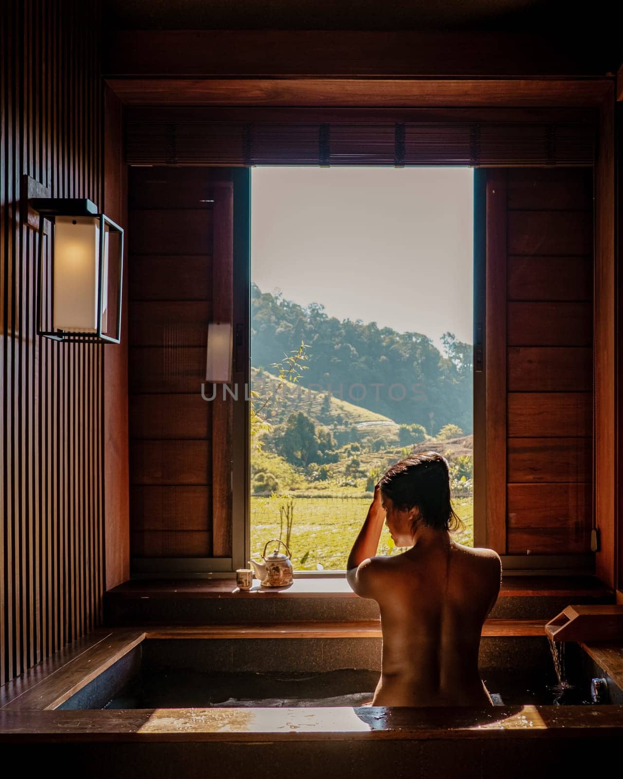 Thailand, Onsen wooden bath tub, Woman enjoys bath at hot springs in Chiang Mai Thailand, Onsen Japanese Bath