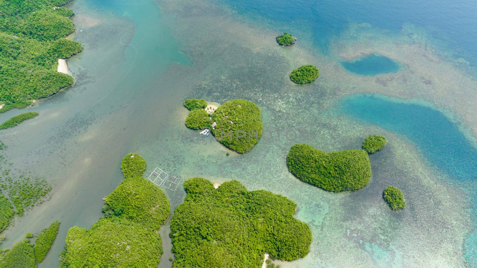 Top view of lagoon with tropical islands Bay with hills. Sipalay, Negros, Philippines.
