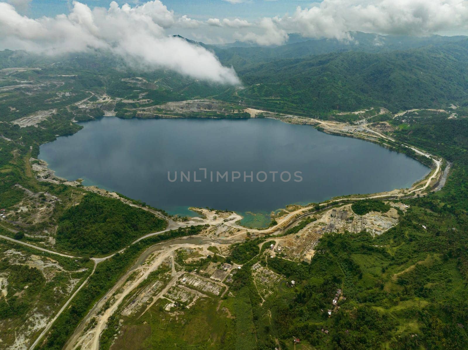 A lake in a flooded mining quarry. Sipalay, Negros, Philippines.