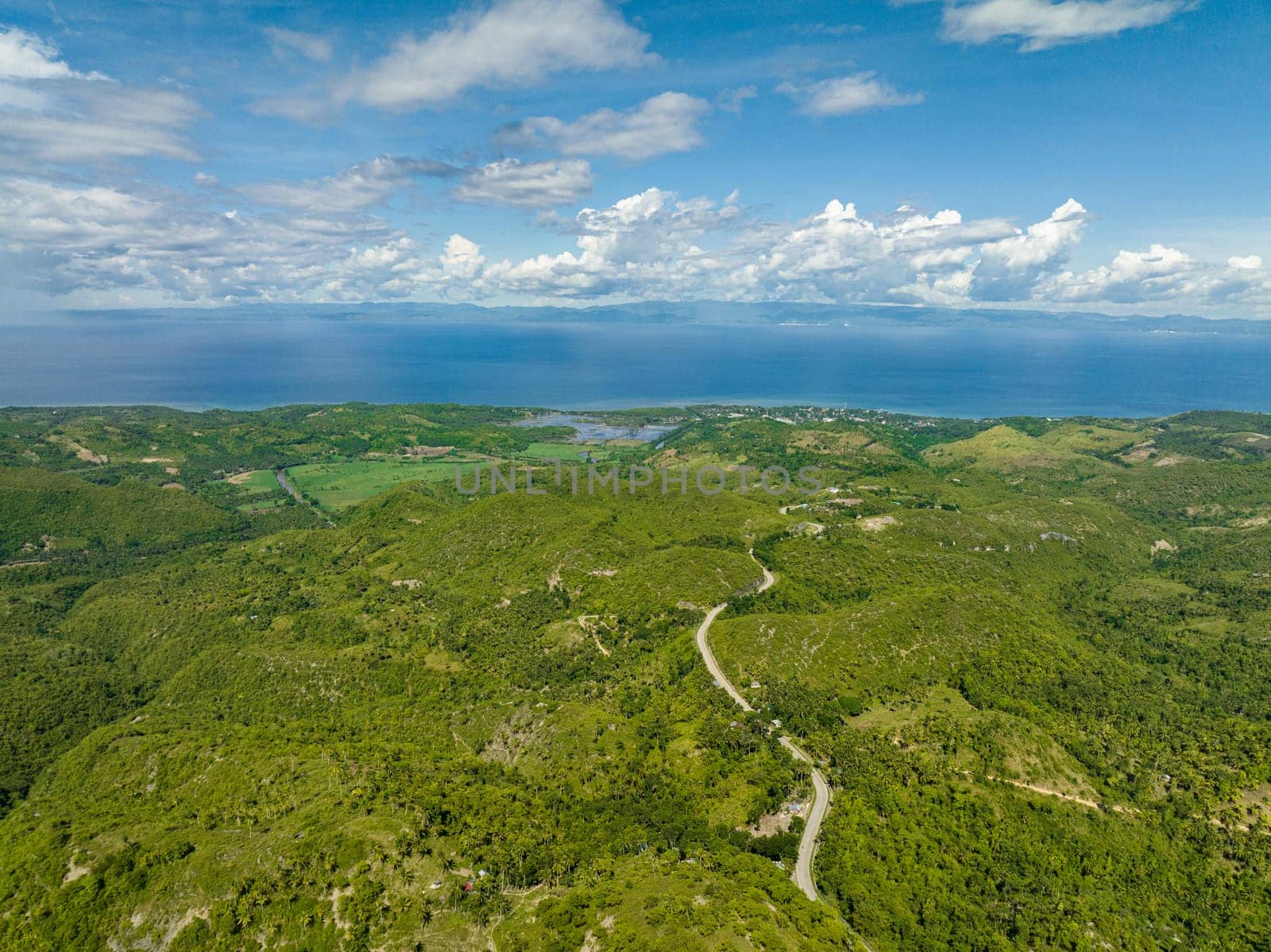 Aerial drone of farmland on the slopes of hills in the mountainous region. Negros, Philippines